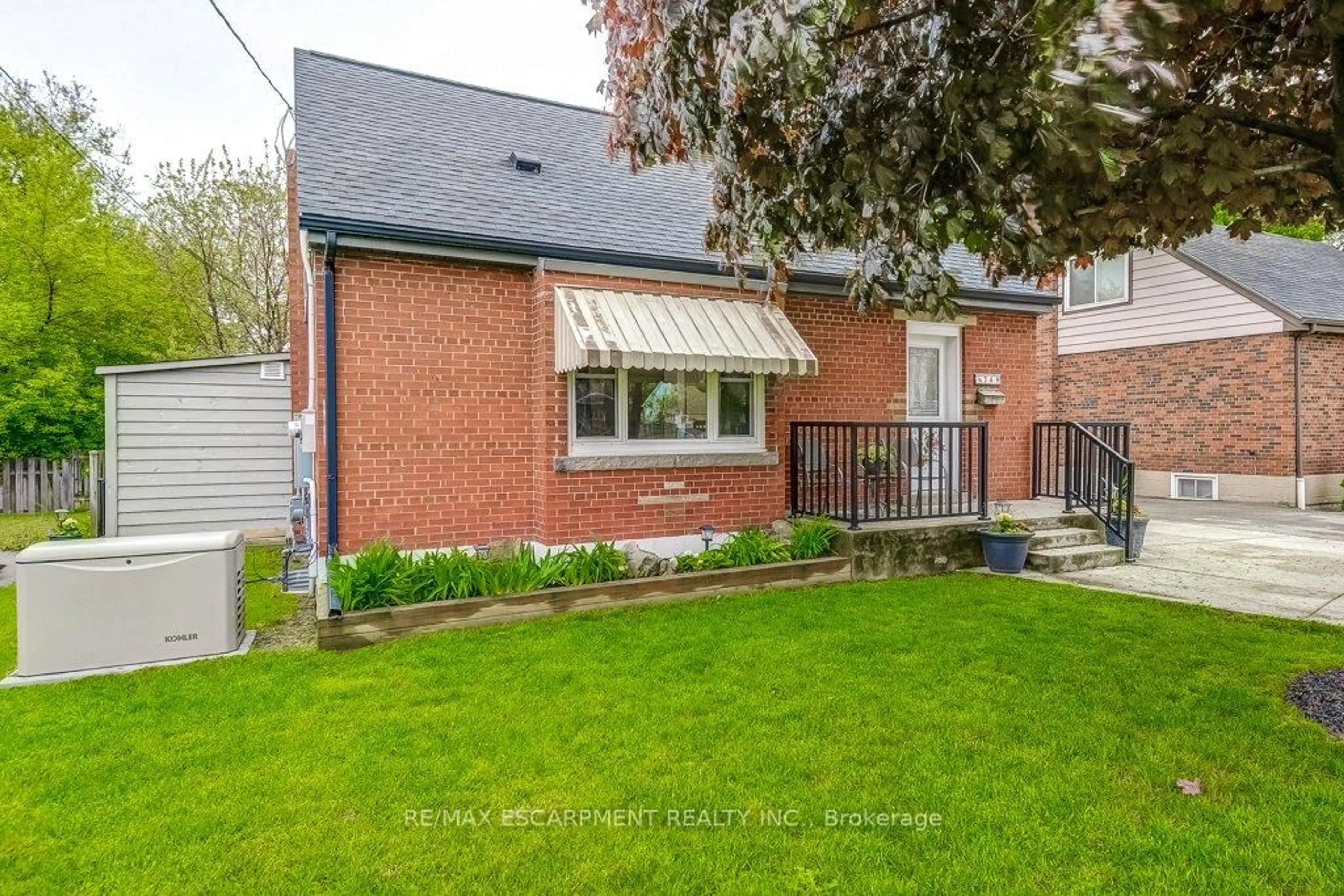 Home with brick exterior material, street for 749 Upper Gage Ave, Hamilton Ontario L8V 4J9