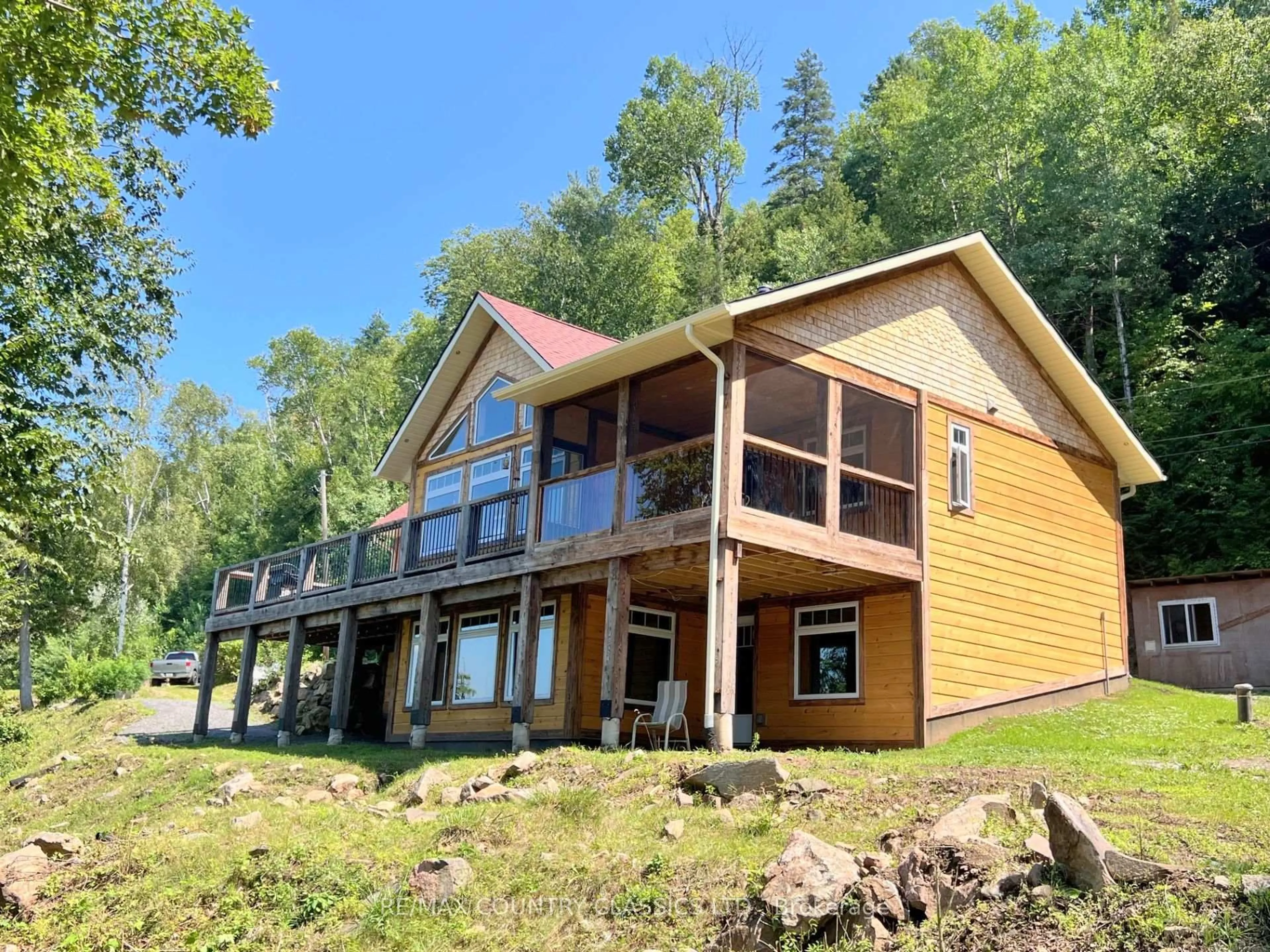 A pic from outside/outdoor area/front of a property/back of a property/a pic from drone, water/lake/river/ocean view for 518 Duncan Lane, Bancroft Ontario K0L 1C0