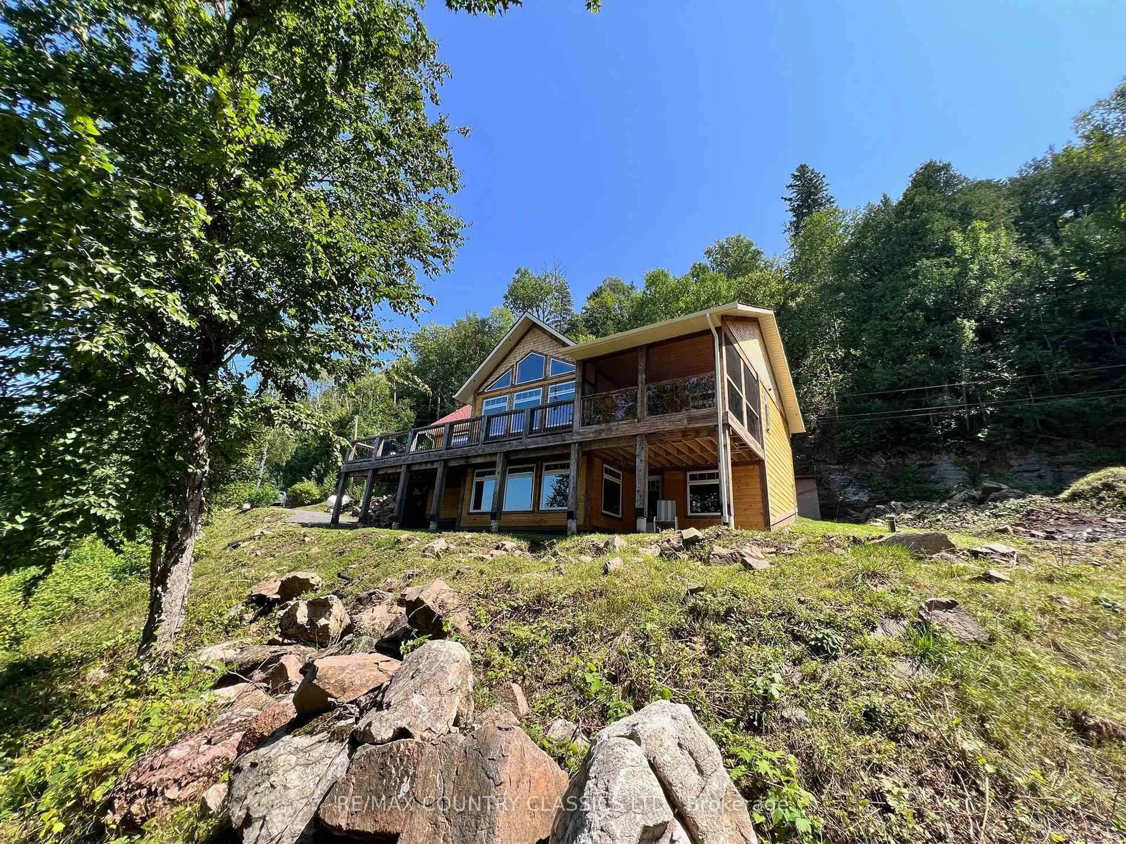 A pic from outside/outdoor area/front of a property/back of a property/a pic from drone, water/lake/river/ocean view for 518 Duncan Lane, Bancroft Ontario K0L 1C0