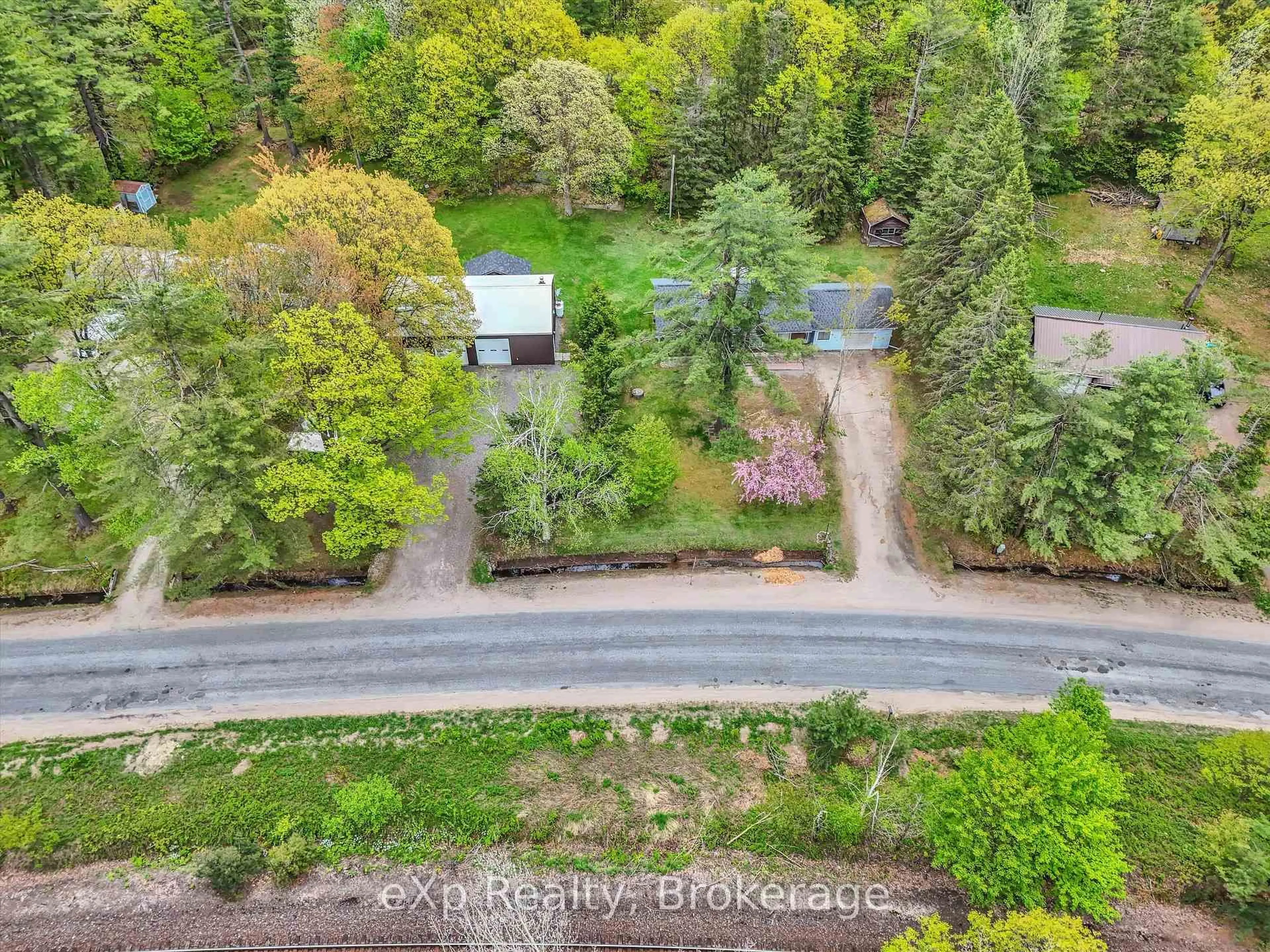 A pic from outside/outdoor area/front of a property/back of a property/a pic from drone, forest/trees view for 1118 Winhara Rd, Gravenhurst Ontario P1P 1R1