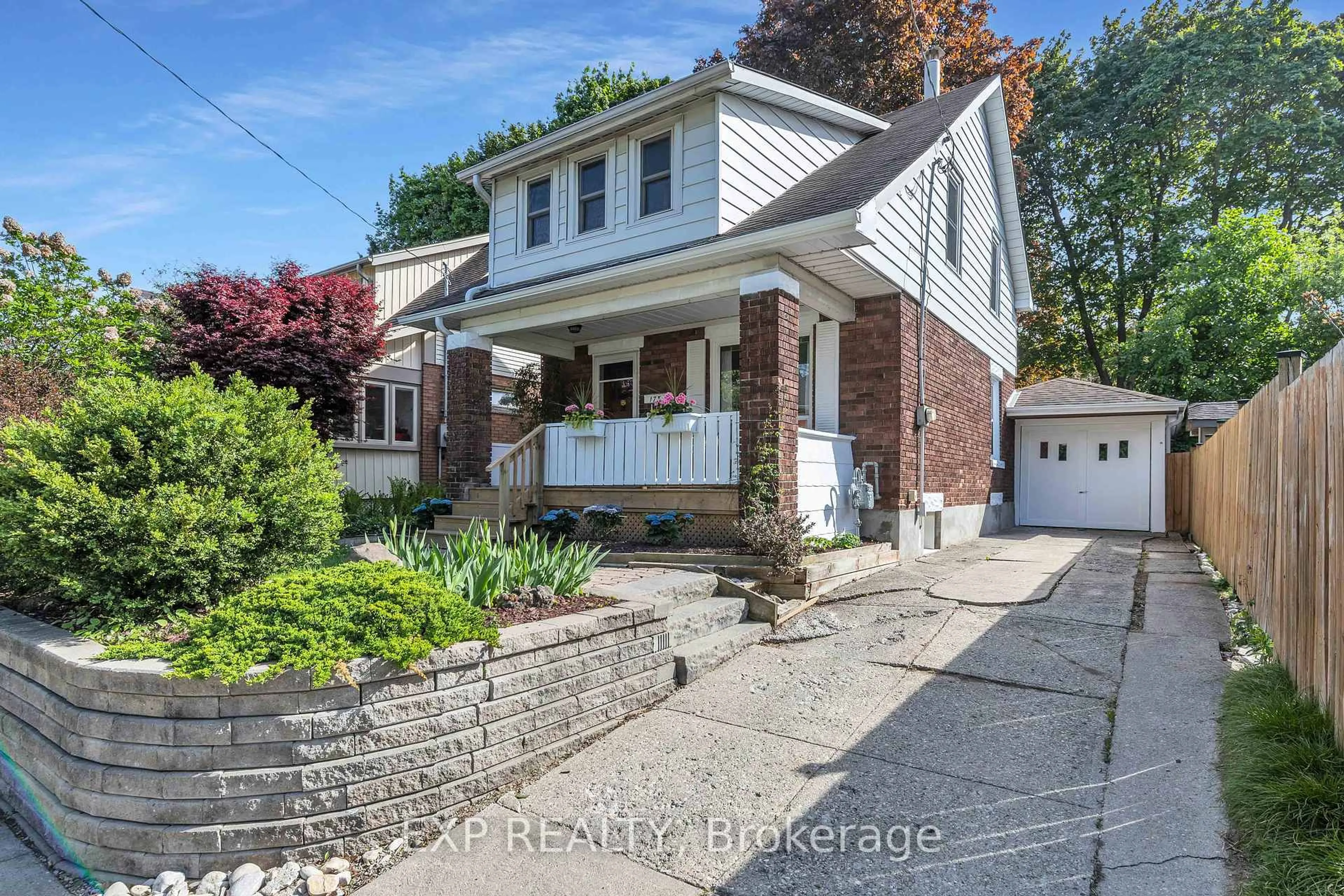 Home with brick exterior material, street for 173 Belmont Ave, Waterloo Ontario N2L 5K3