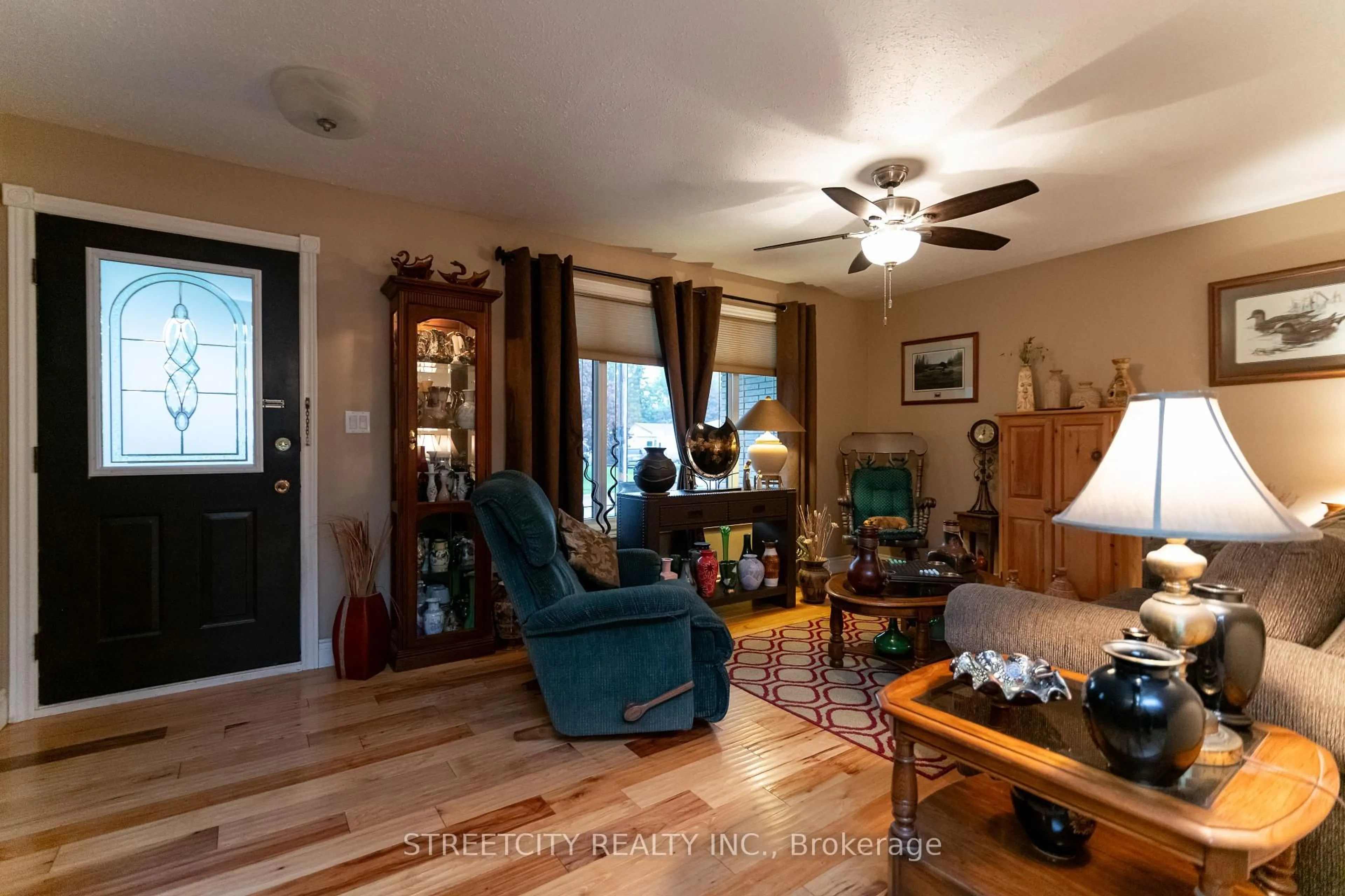 Living room with furniture, wood/laminate floor for 10 Hidden Valley Dr, Chatham-Kent Ontario N0P 1A0