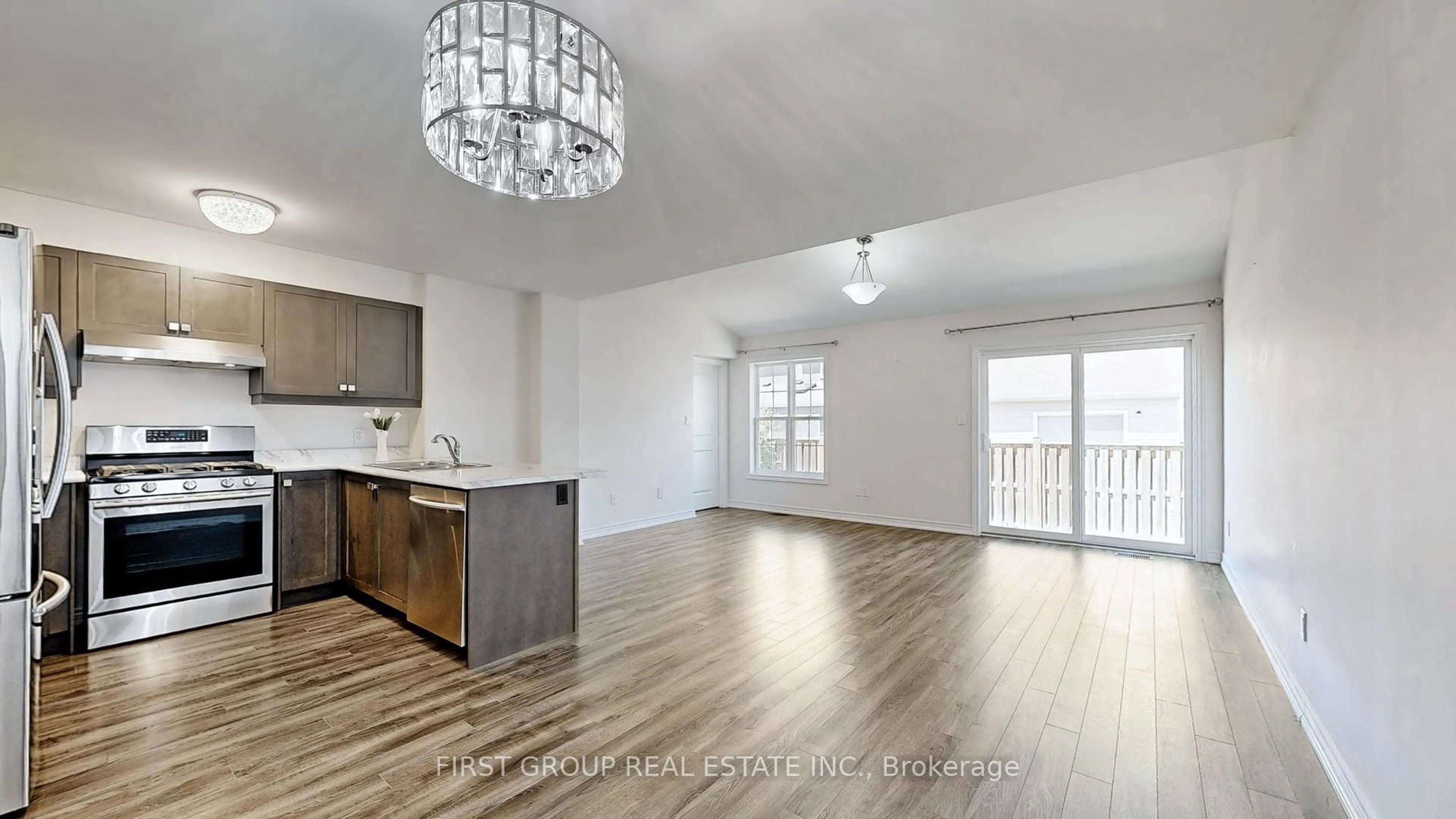 Open concept kitchen, wood/laminate floor for 562 Grange Way, Peterborough North Ontario K9H 7M9