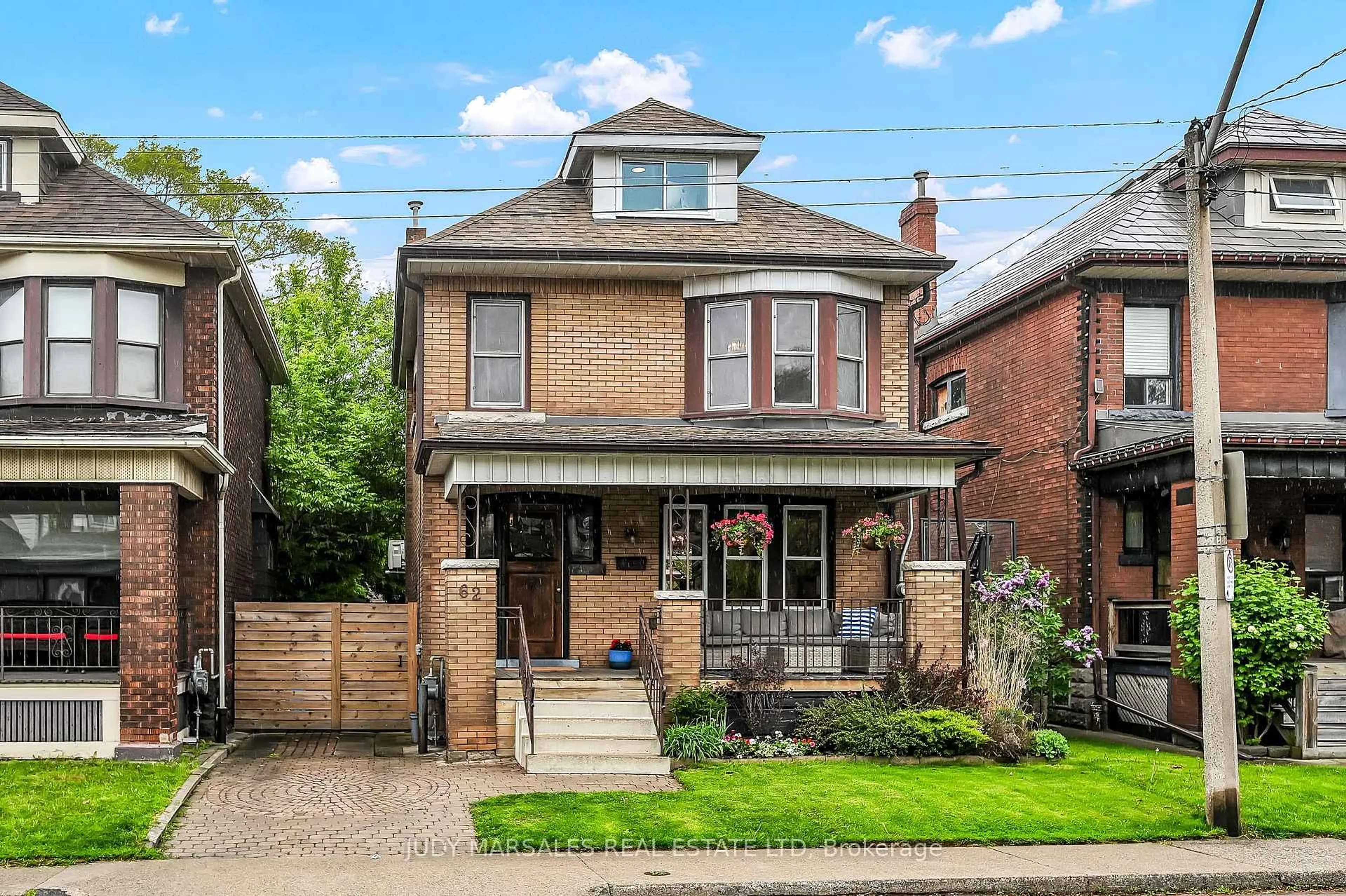 Home with brick exterior material, street for 62 Kensington Ave, Hamilton Ontario L8L 7N2