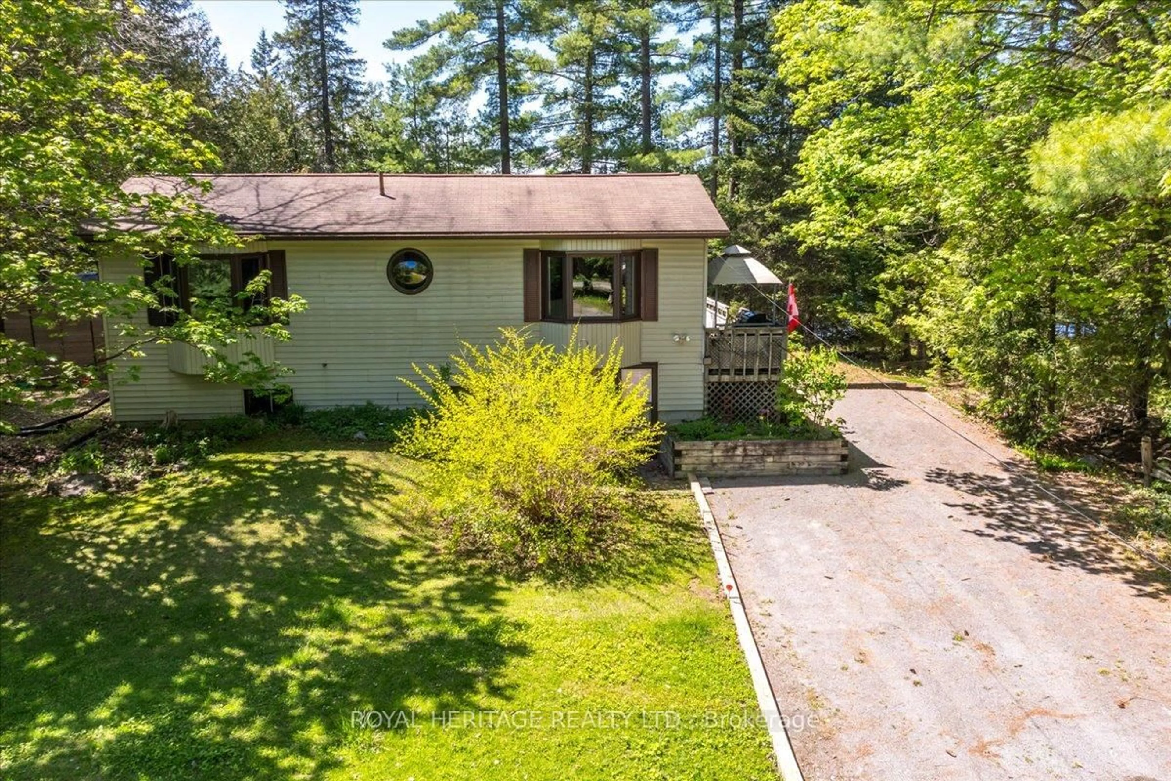 A pic from outside/outdoor area/front of a property/back of a property/a pic from drone, forest/trees view for 25 (36) LITTLE SILVER LAKE Way, Trent Lakes Ontario K0M 1A0