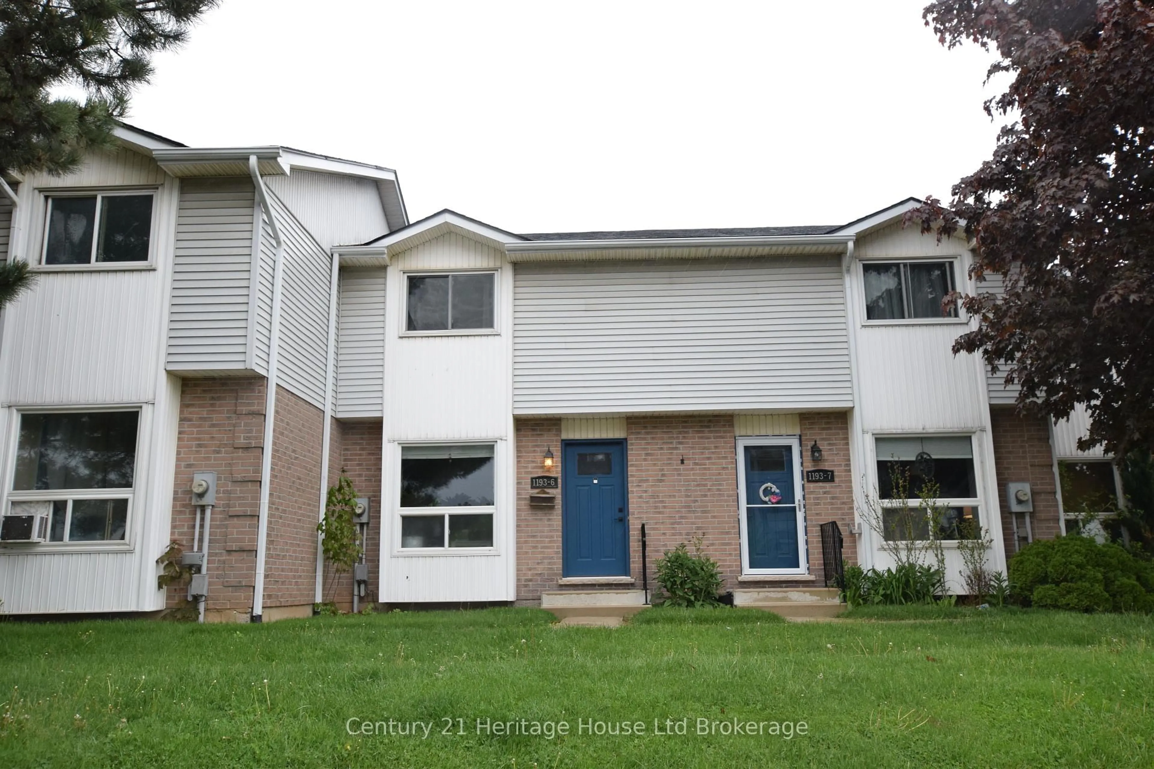 Home with vinyl exterior material, street for 1193 Nellis St #6, Woodstock Ontario N4T 1N5