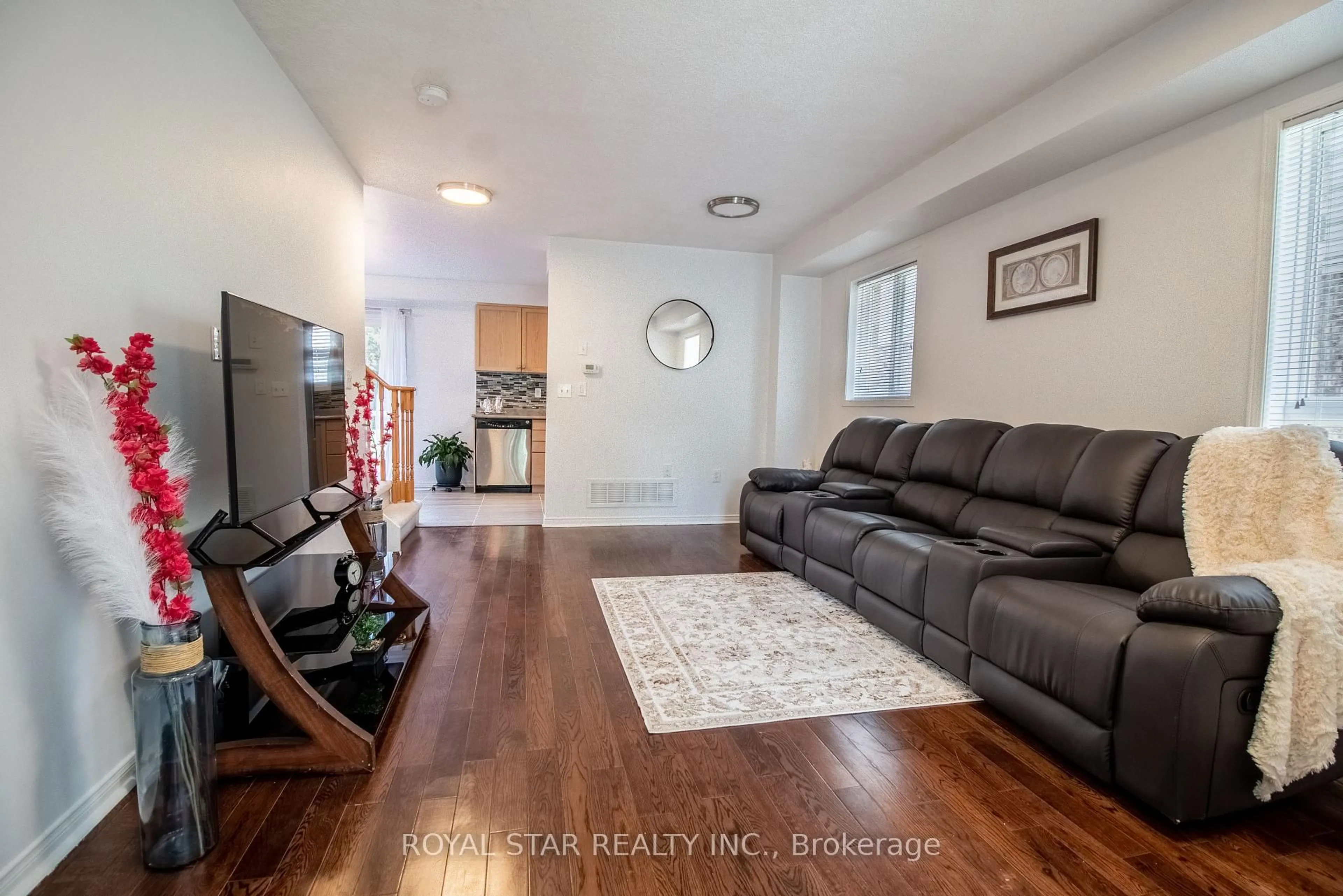 Living room with furniture, wood/laminate floor for 44 Wheeler Dr, Cambridge Ontario N1P 1G4