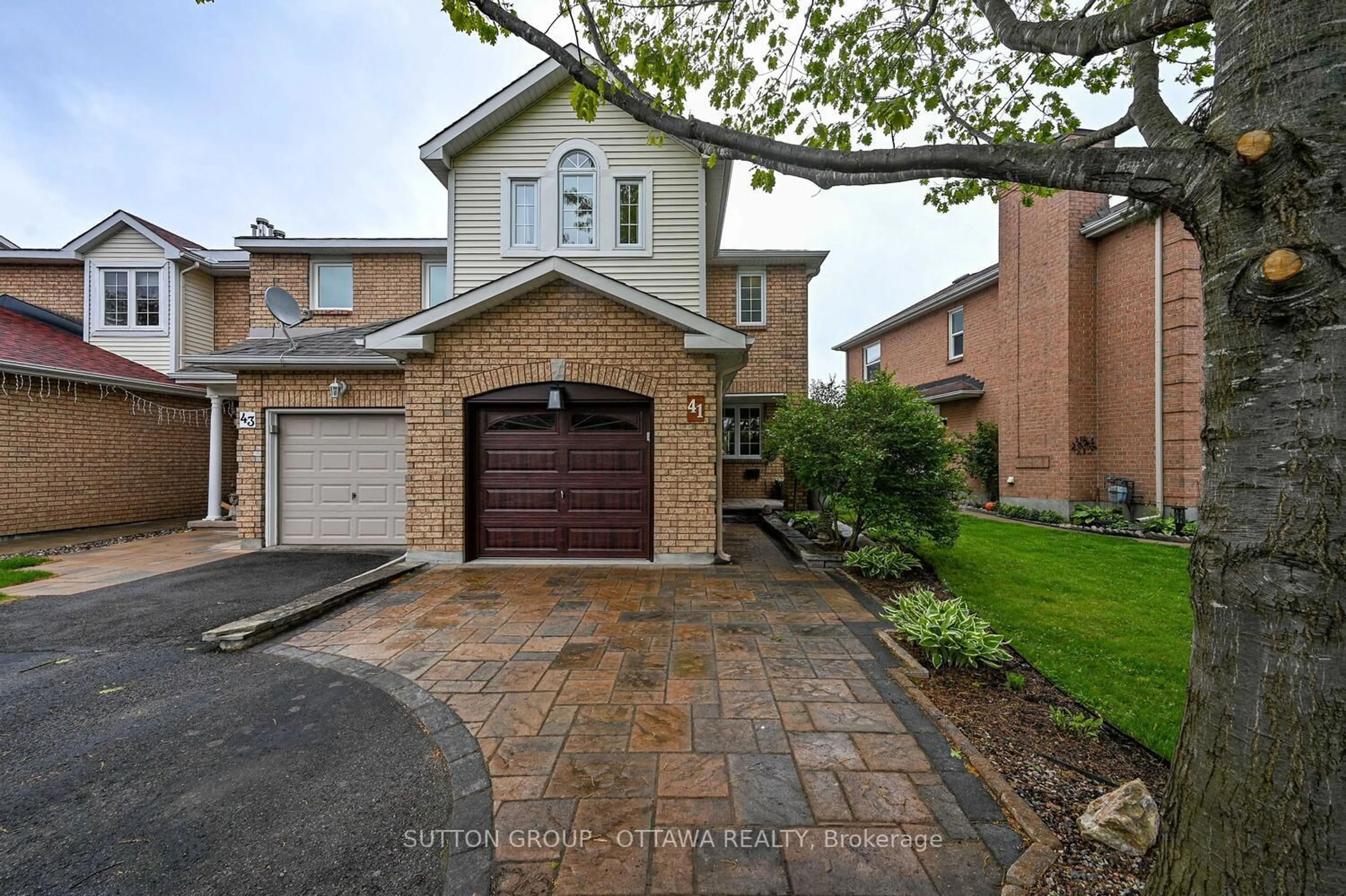 Home with brick exterior material, street for 41 Mountshannon Dr, Ottawa Ontario K2J 4B8