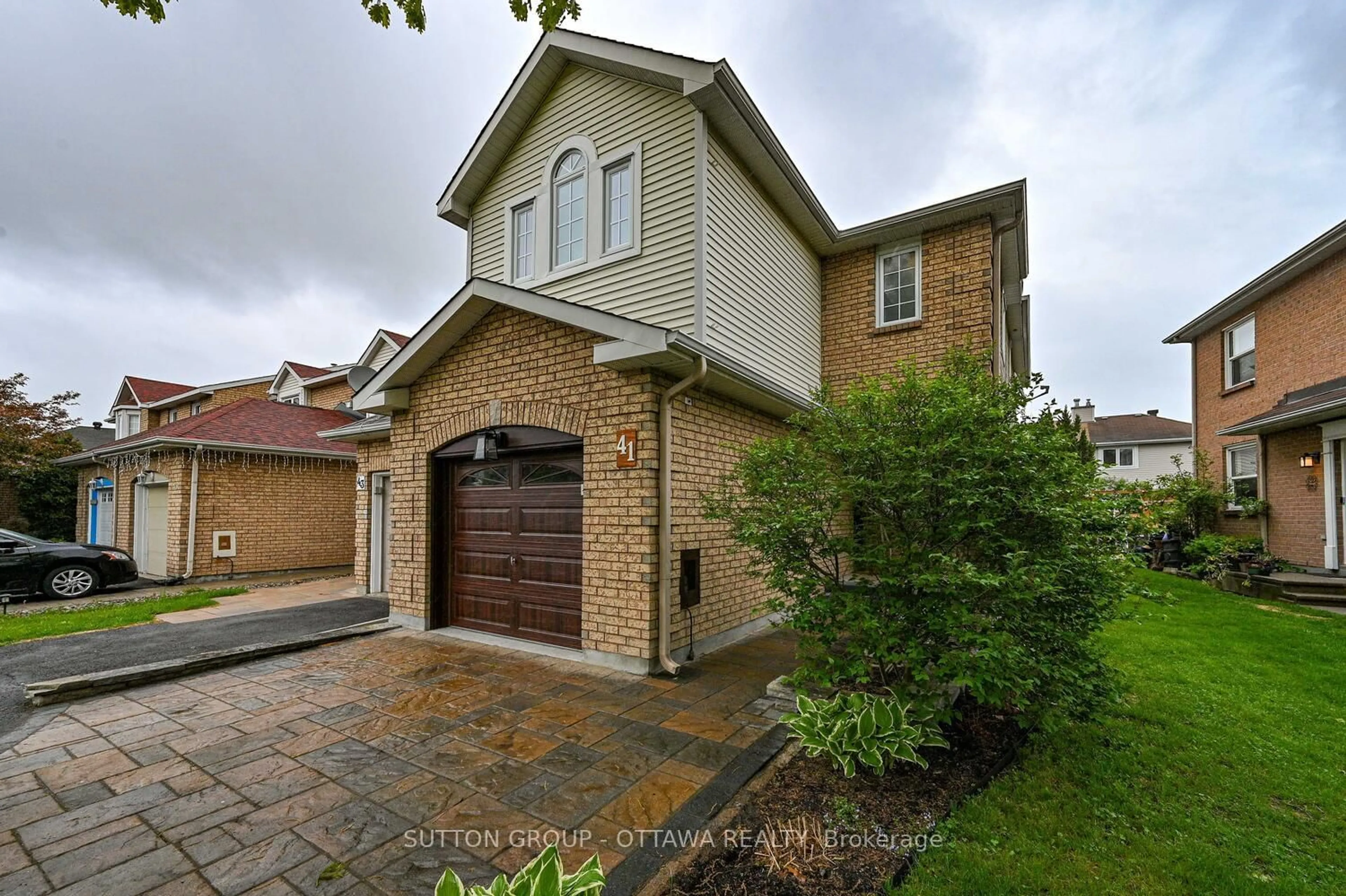 Home with brick exterior material, street for 41 Mountshannon Dr, Ottawa Ontario K2J 4B8