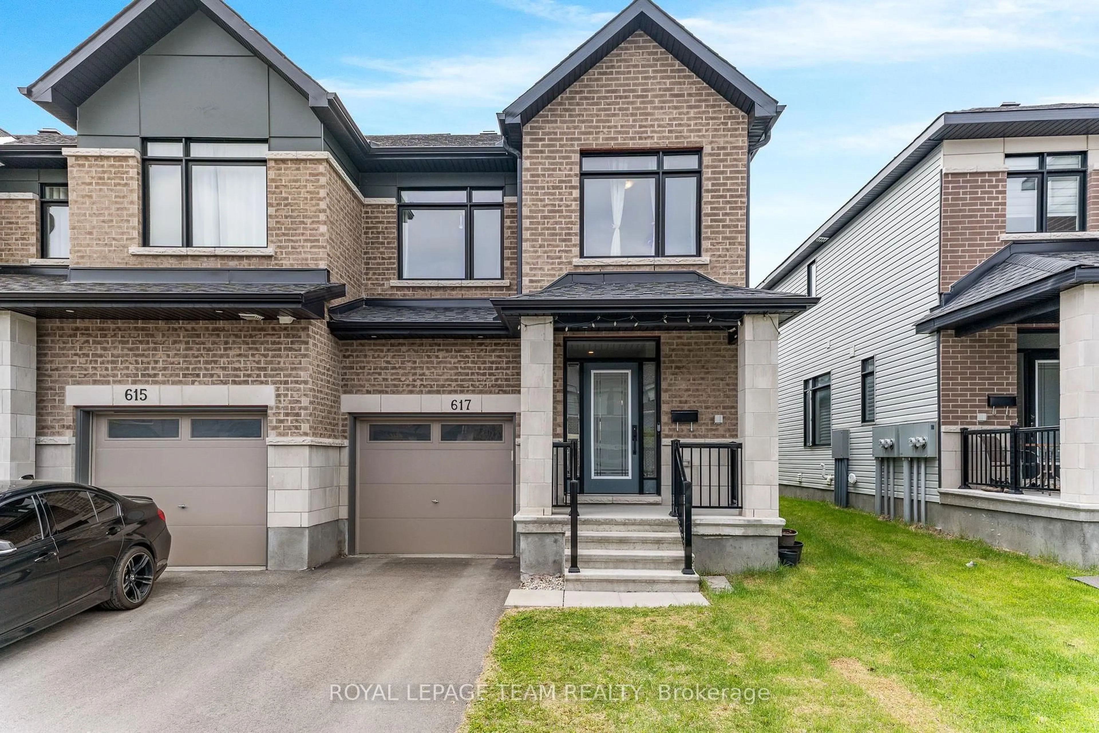 Home with brick exterior material, street for 617 Rathburn Lane, Ottawa Ontario K1T 0V7