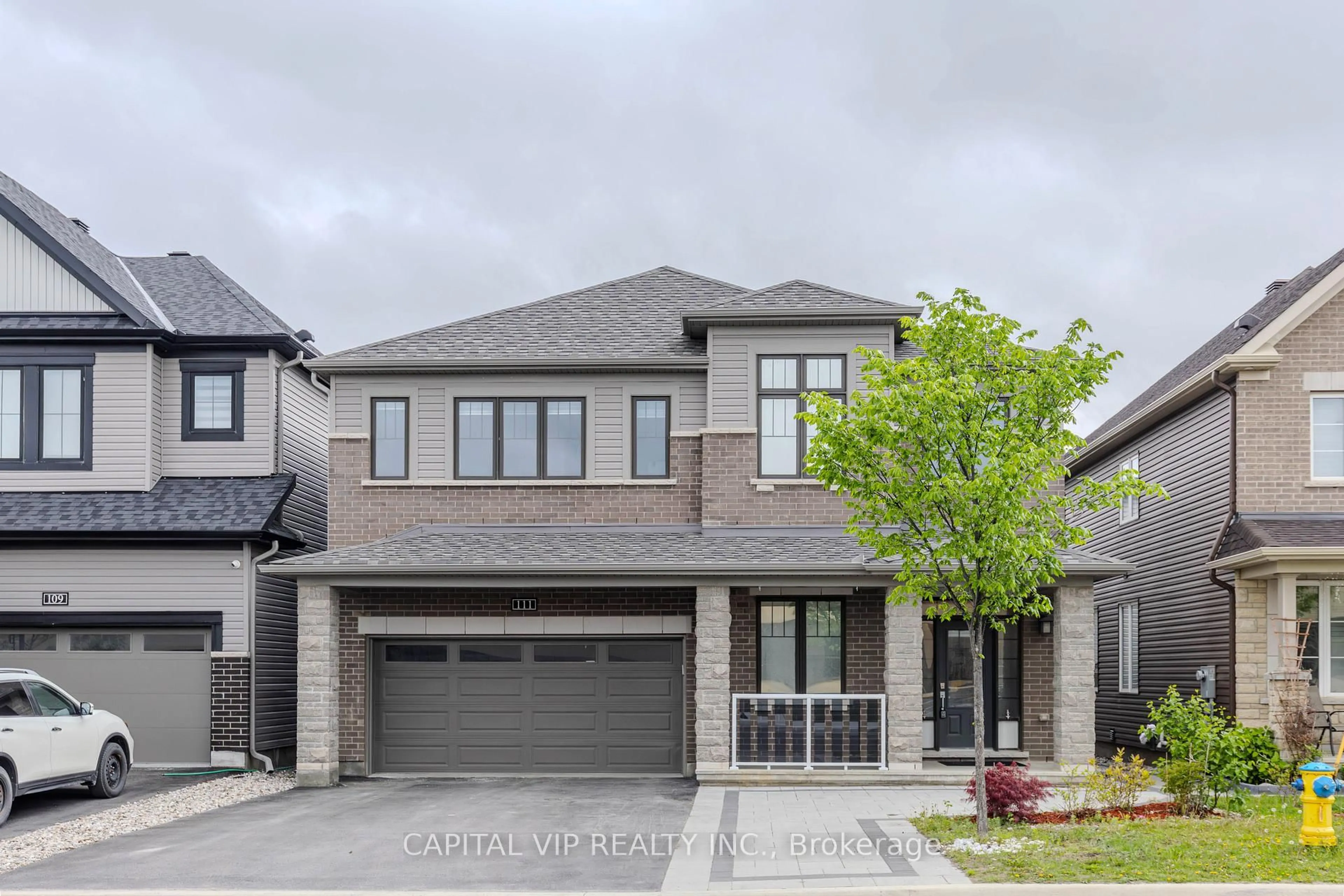 Home with brick exterior material, street for 111 Robin Easey Ave, Ottawa Ontario K2J 6S3