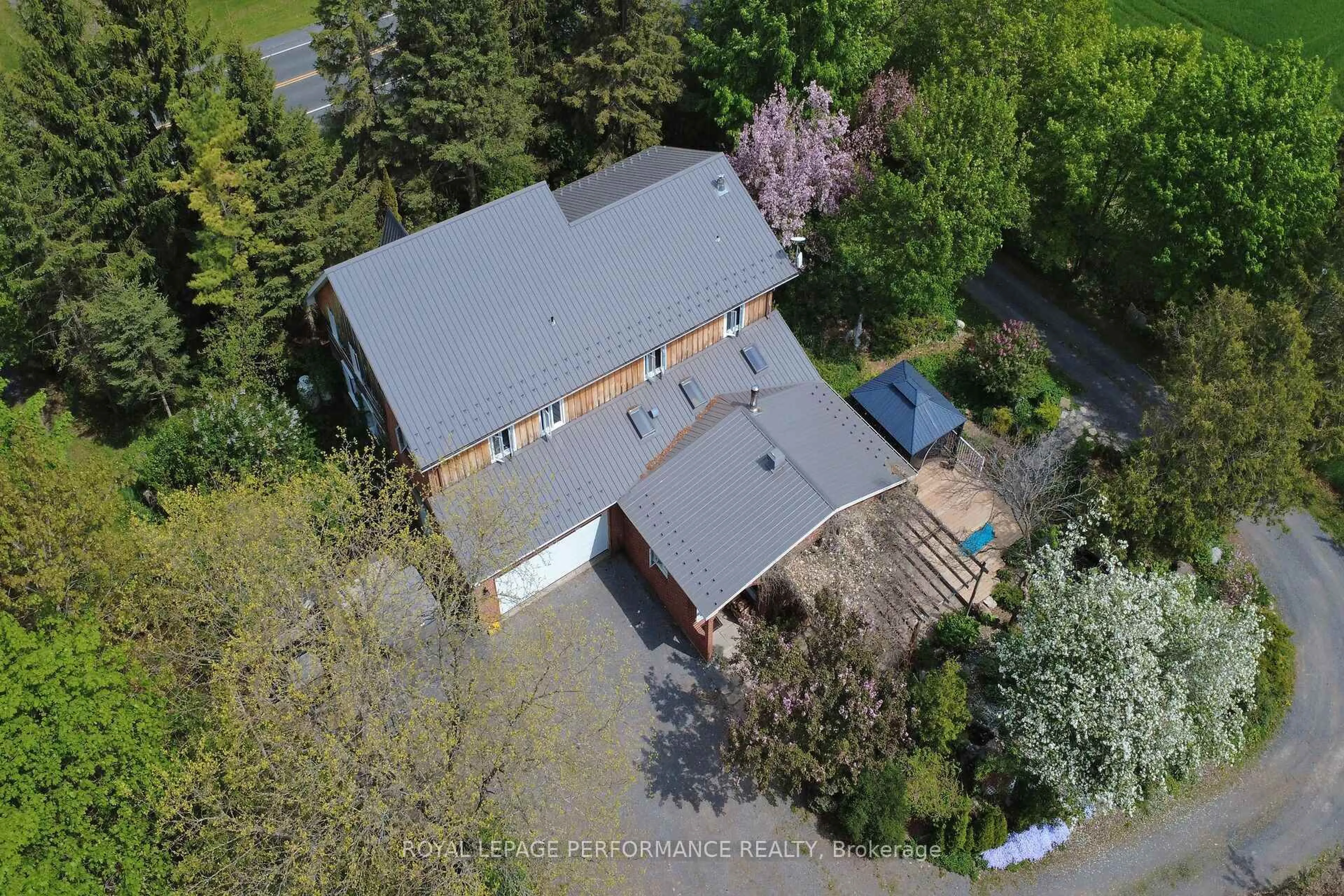 A pic from outside/outdoor area/front of a property/back of a property/a pic from drone, street for 14120 County Road 13 Rd, North Stormont Ontario K0A 1R0