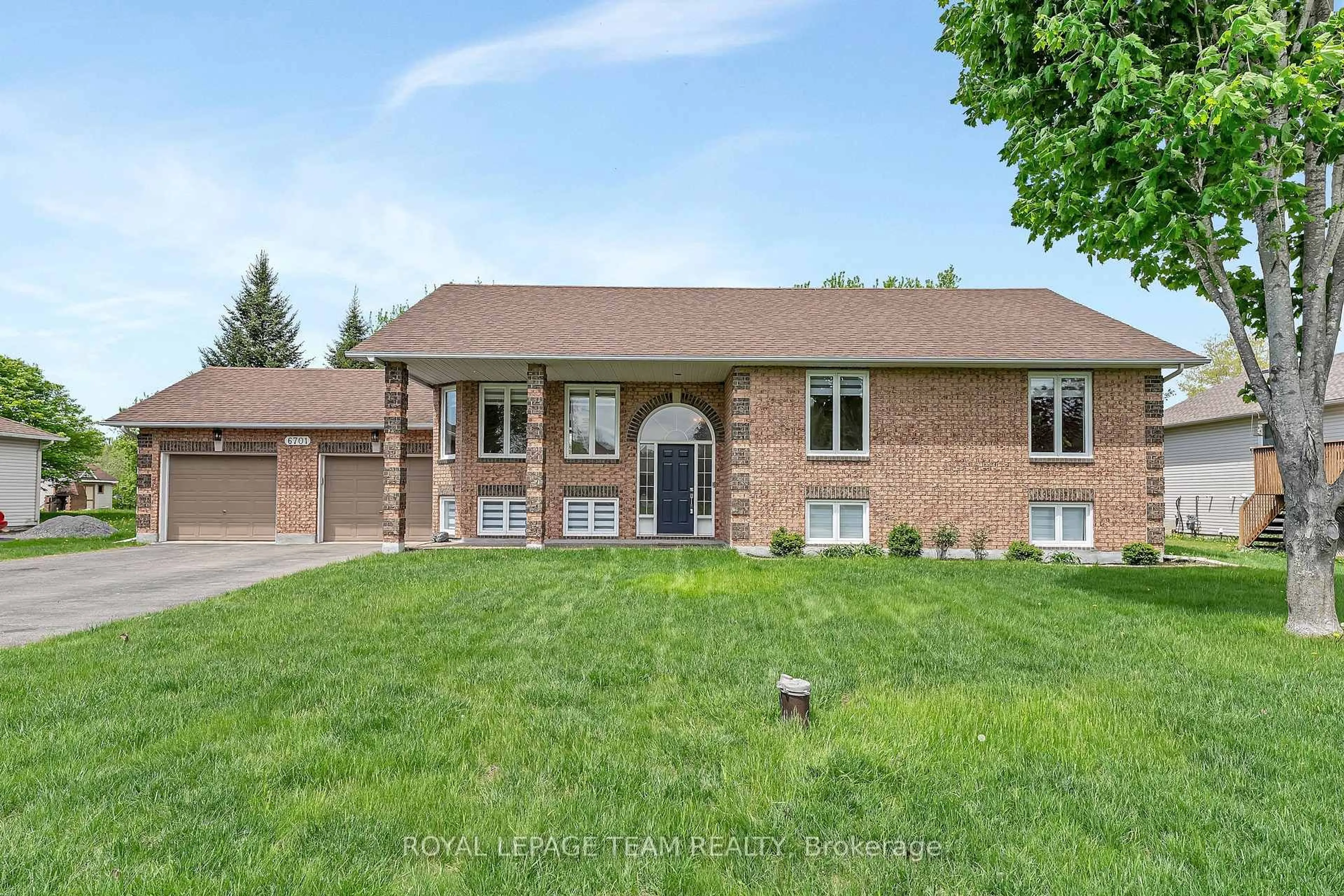 Home with brick exterior material, street for 6701 Tommary Dr, Ottawa Ontario K4P 1G8