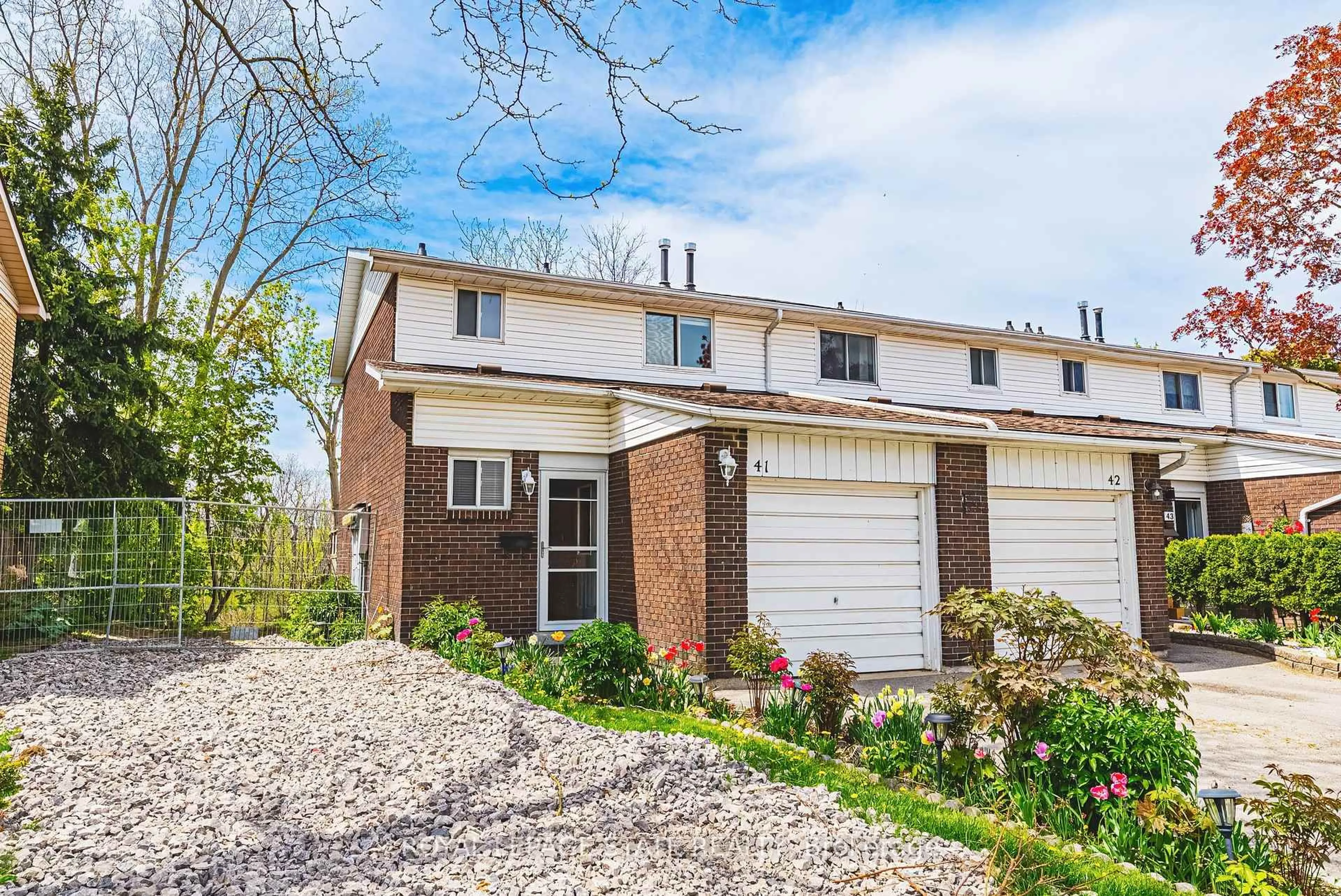 Home with brick exterior material, street for 100 Quigley Rd #41, Hamilton Ontario L8K 6J1