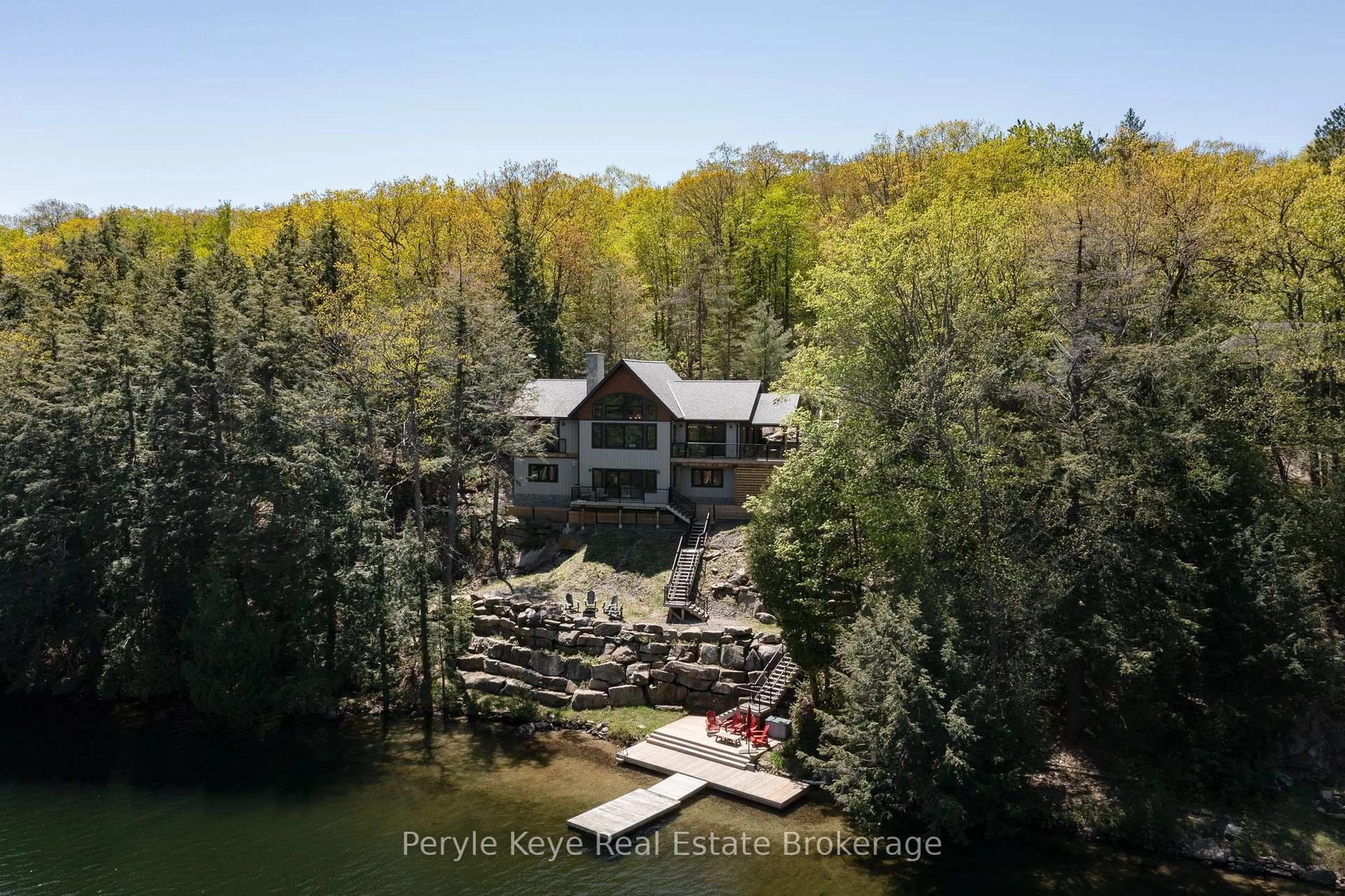 A pic from outside/outdoor area/front of a property/back of a property/a pic from drone, water/lake/river/ocean view for 1051 Lakeview Rd, Muskoka Lakes Ontario P0B 1M0