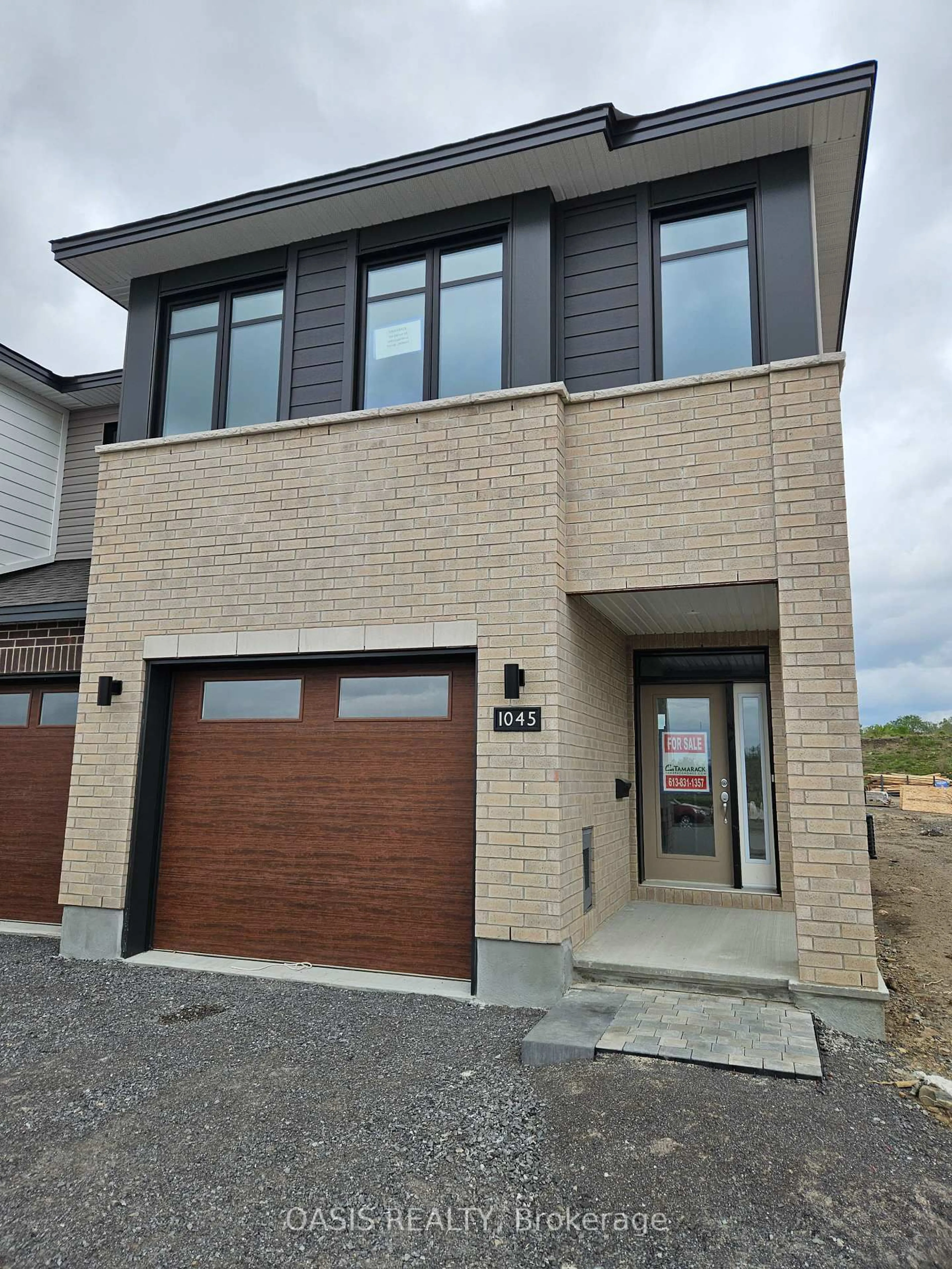 Home with brick exterior material, street for 1045 Cope Dr, Stittsville Ontario K2S 3B5