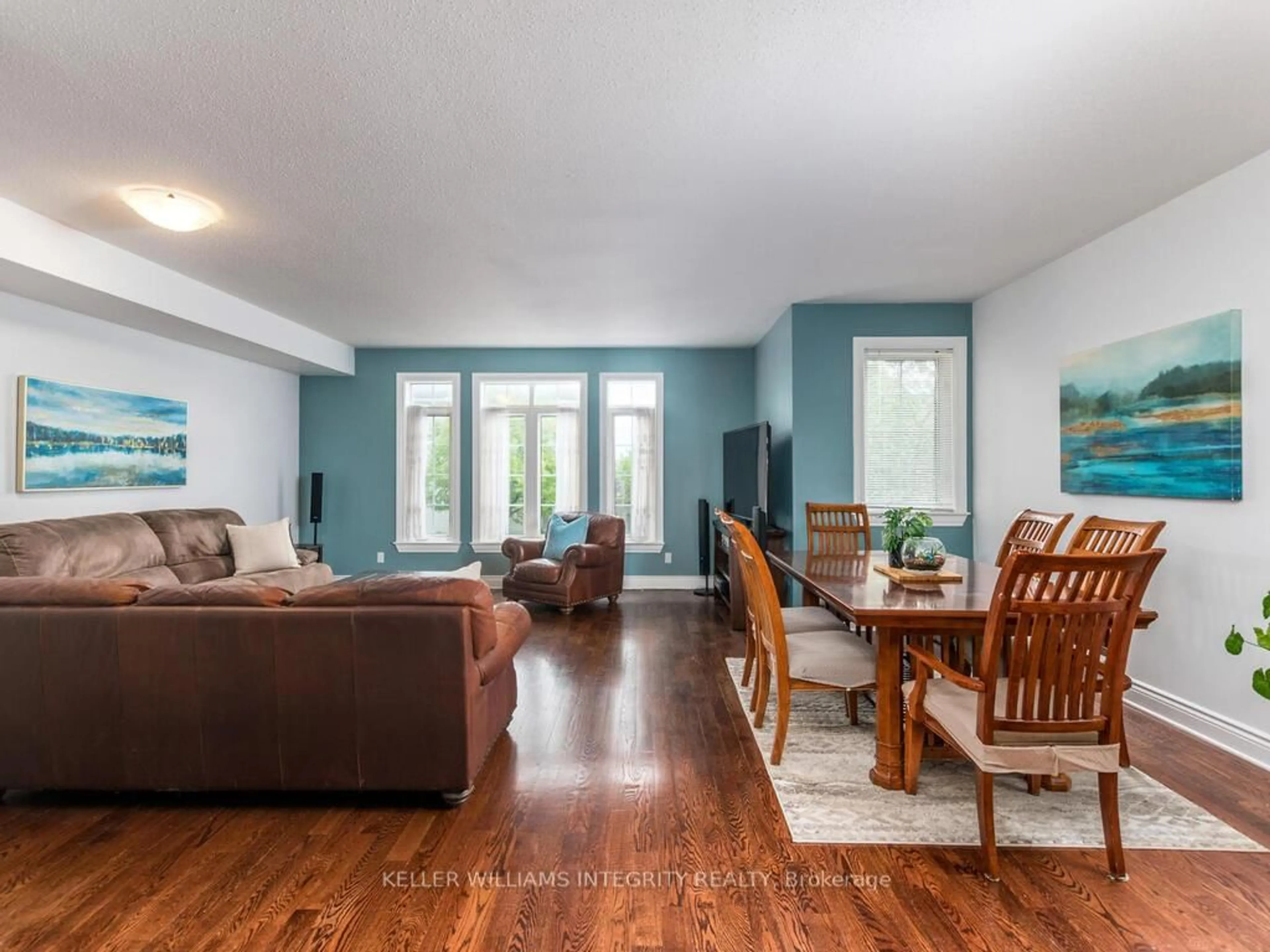 Living room with furniture, wood/laminate floor for 72 Castle Glen Cres, Ottawa Ontario K2L 4H1