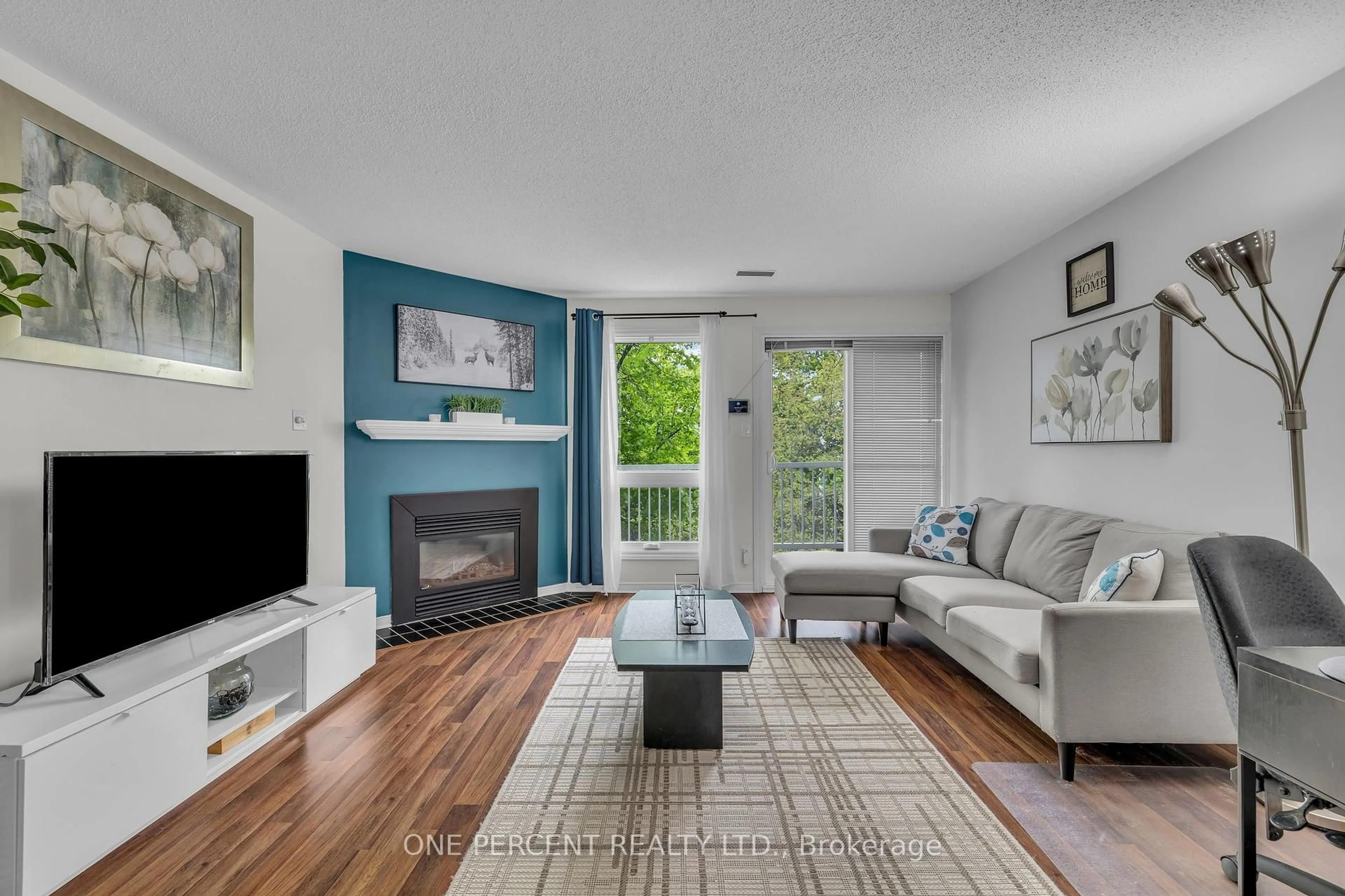 Living room with furniture, wood/laminate floor for 6289 Tealwood Pl #19, Ottawa Ontario K1C 7J9
