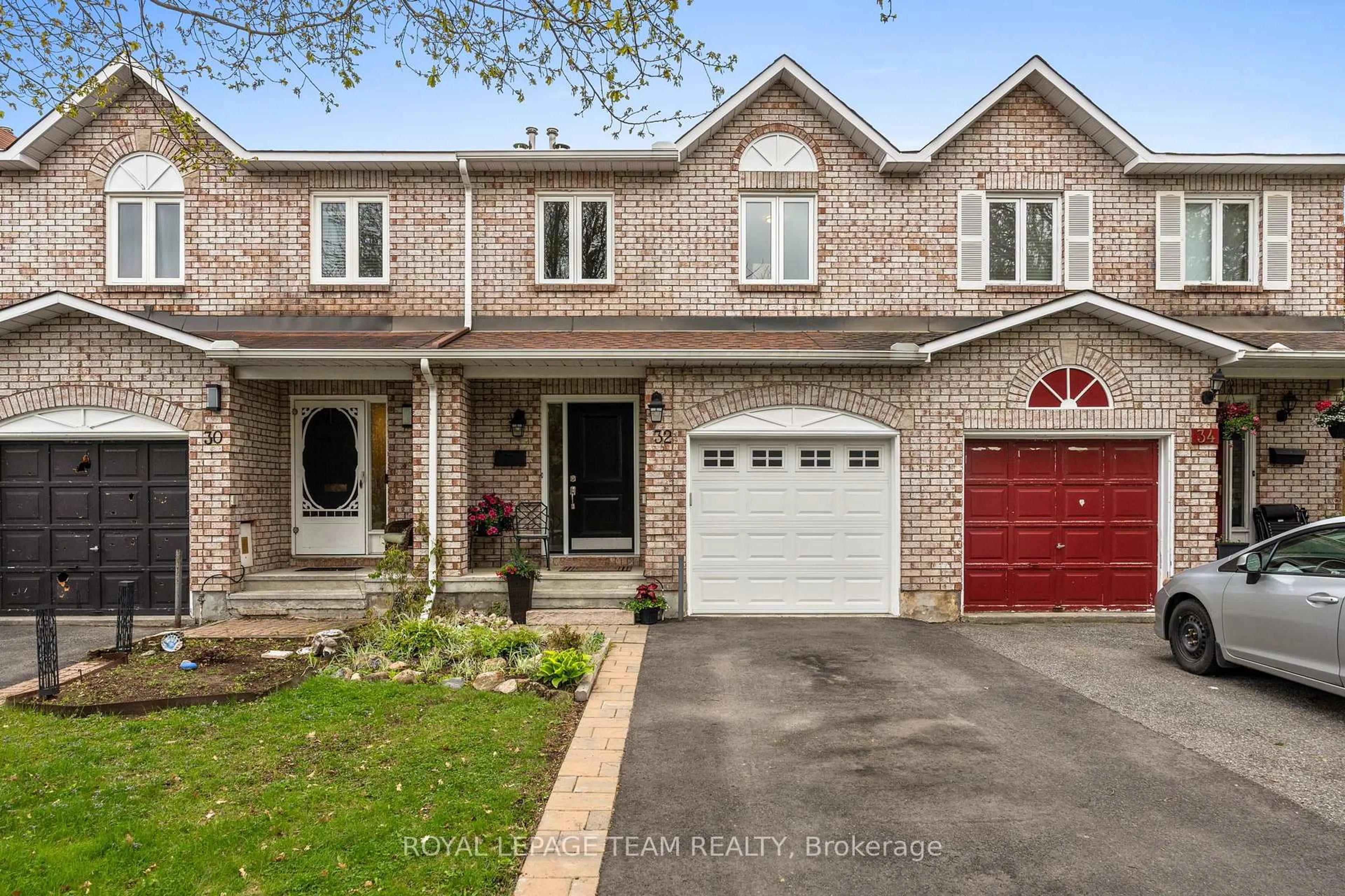 Home with brick exterior material, street for 32 Whitegate Cres, Ottawa Ontario K2J 4B6