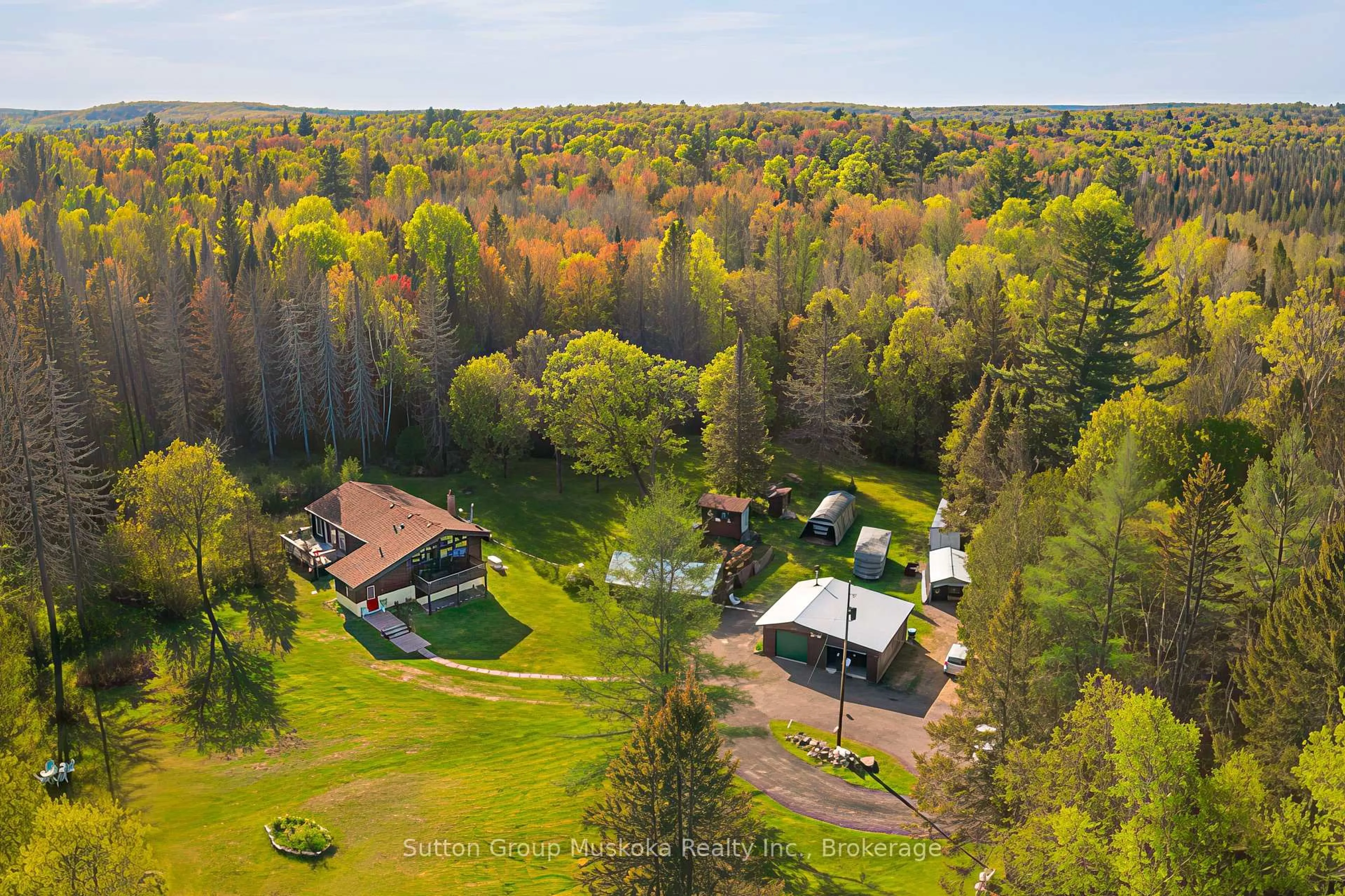A pic from outside/outdoor area/front of a property/back of a property/a pic from drone, forest/trees view for 1405 Pevensey Rd, Armour Ontario P1H 1Z0