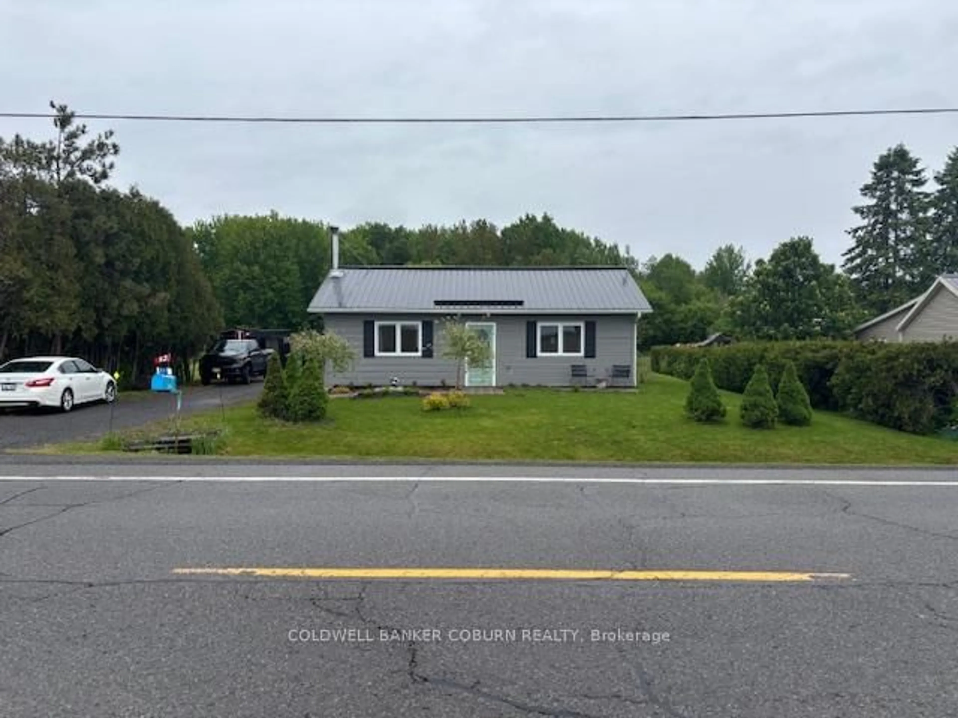 A pic from outside/outdoor area/front of a property/back of a property/a pic from drone, street for 11397 County Rd 18 Highway, South Dundas Ontario K0E 1C0