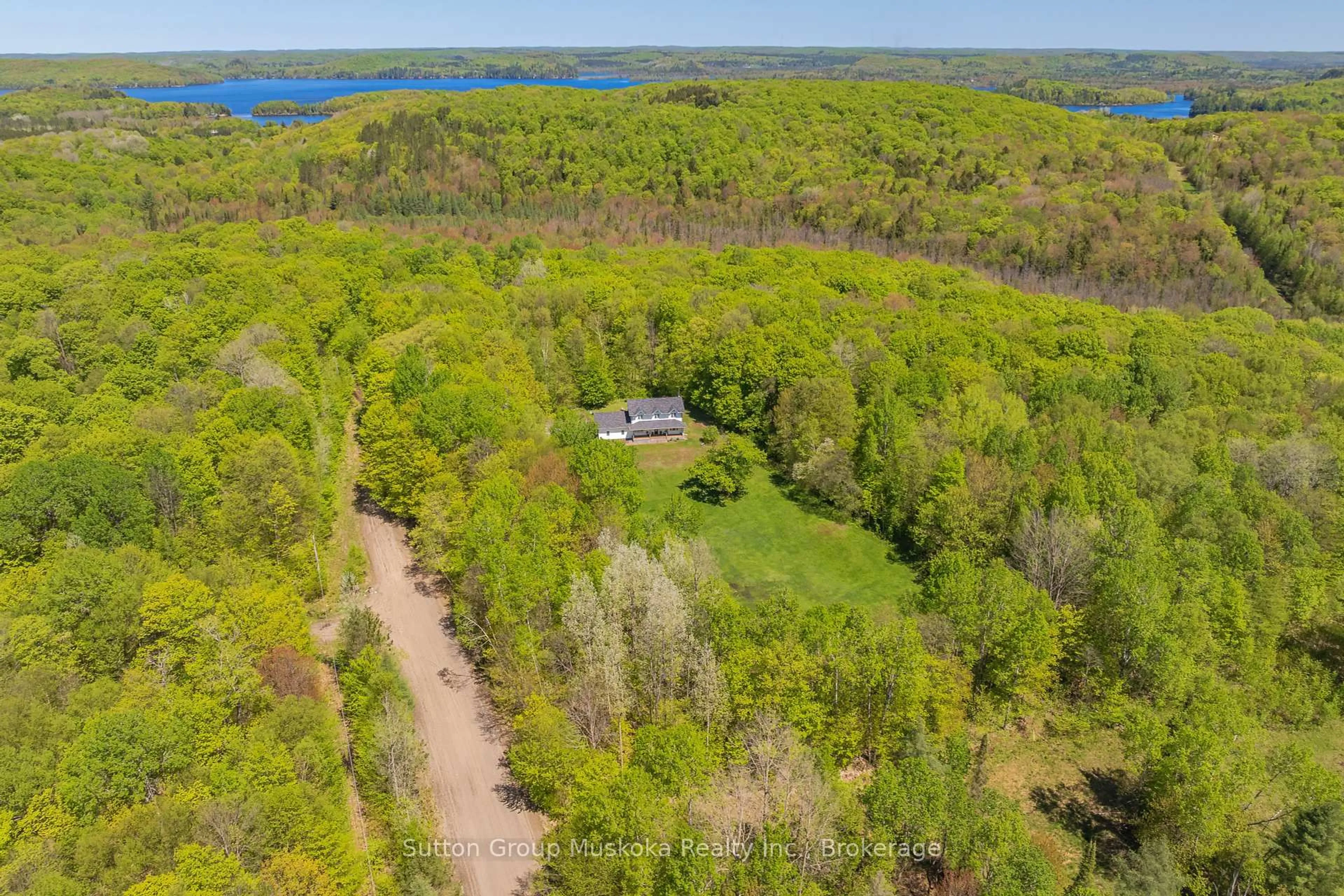 A pic from outside/outdoor area/front of a property/back of a property/a pic from drone, water/lake/river/ocean view for 240 Madill Church Rd, Huntsville Ontario P1H 1A1