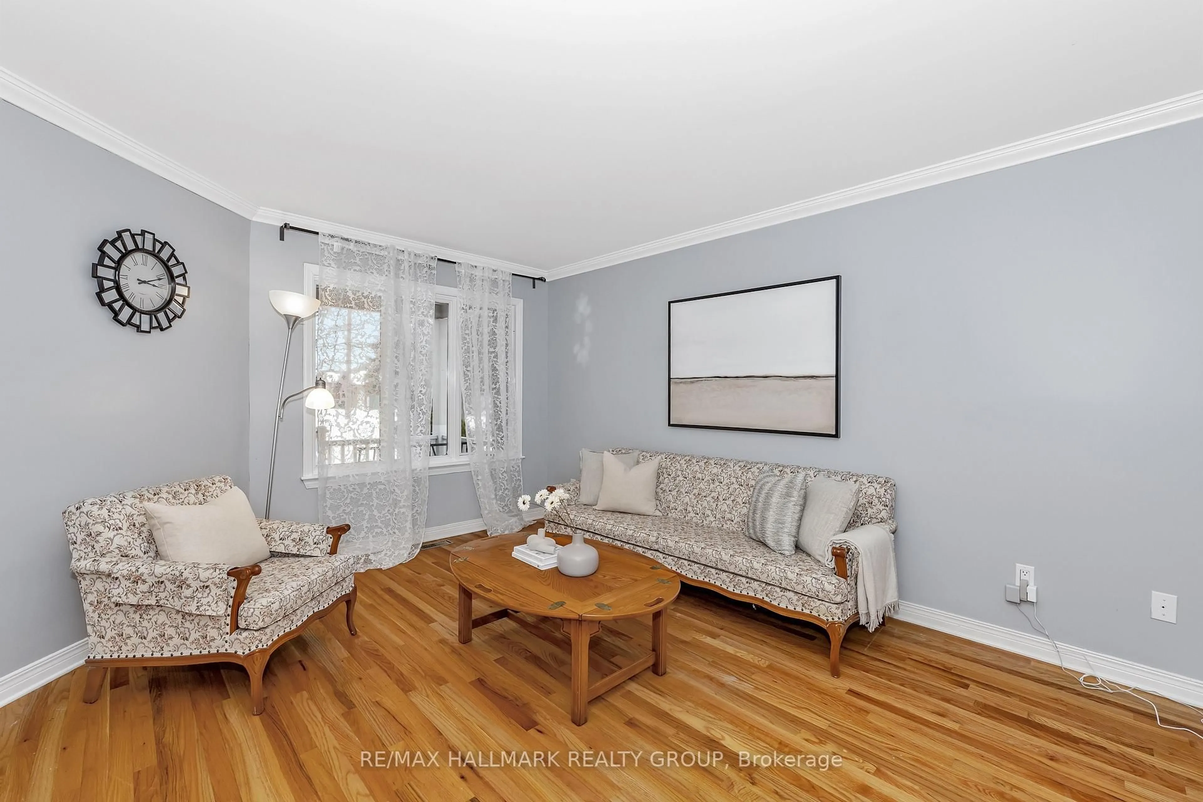 Living room with furniture, wood/laminate floor for 63 NEWBOROUGH Cres, Ottawa Ontario K2G 6A5