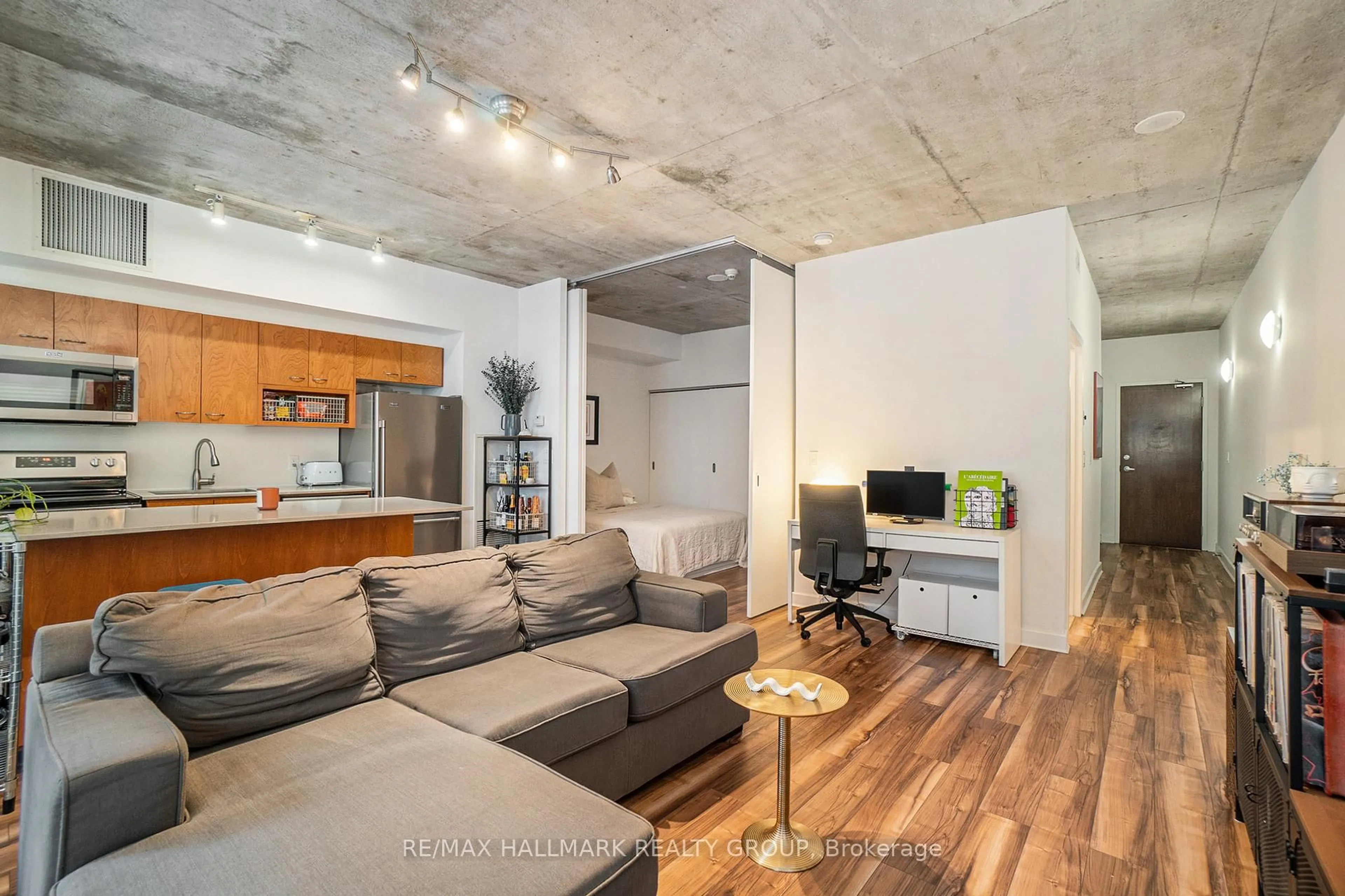 Living room with furniture, cement floor for 179 GEORGE St #704, Ottawa Ontario K1N 1J8