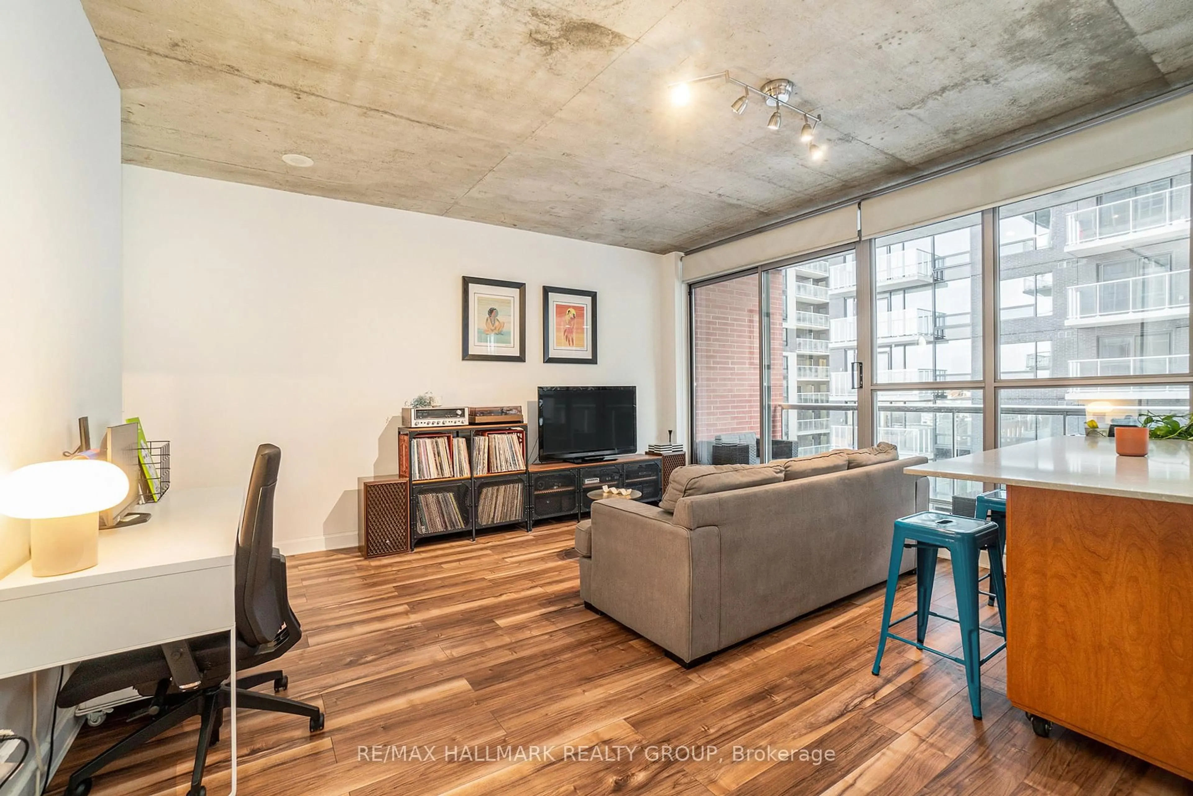 Living room with furniture, cement floor for 179 GEORGE St #704, Ottawa Ontario K1N 1J8