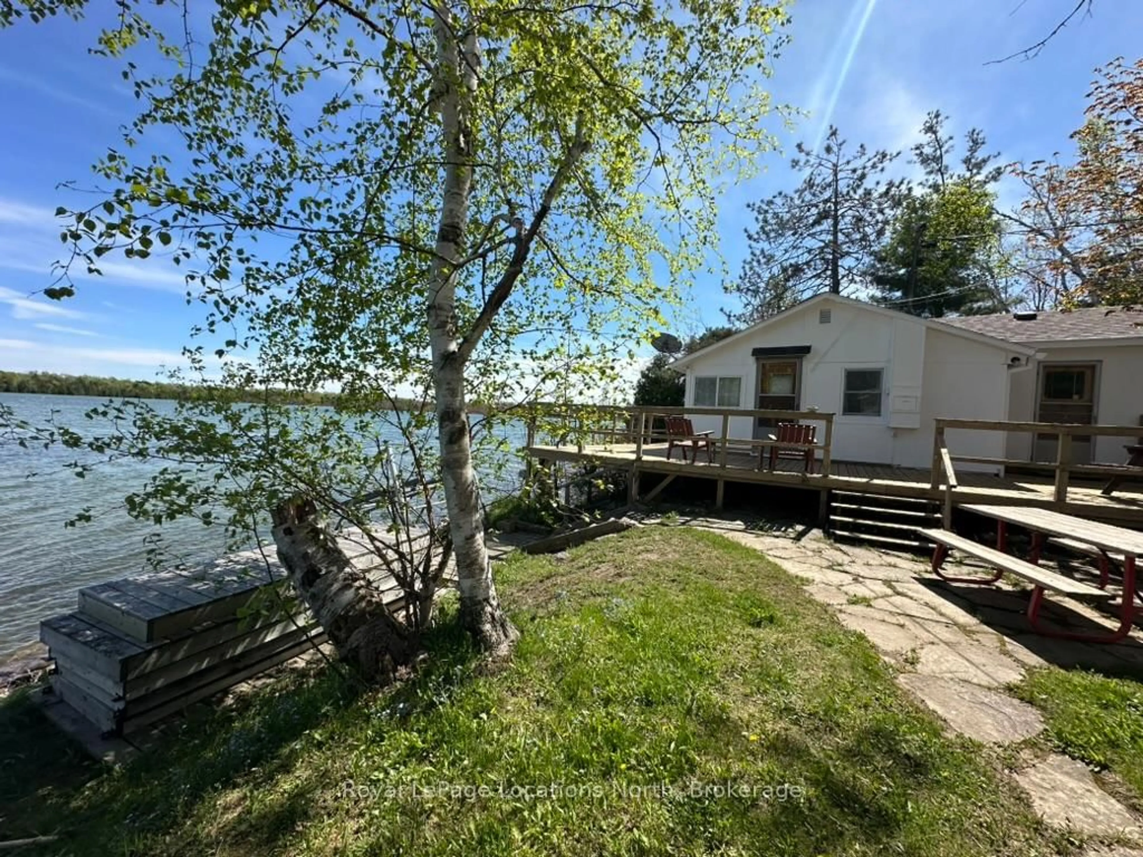 A pic from outside/outdoor area/front of a property/back of a property/a pic from drone, water/lake/river/ocean view for 62 Miller Lake Shore Rd, Northern Bruce Peninsula Ontario N0H 1Z0
