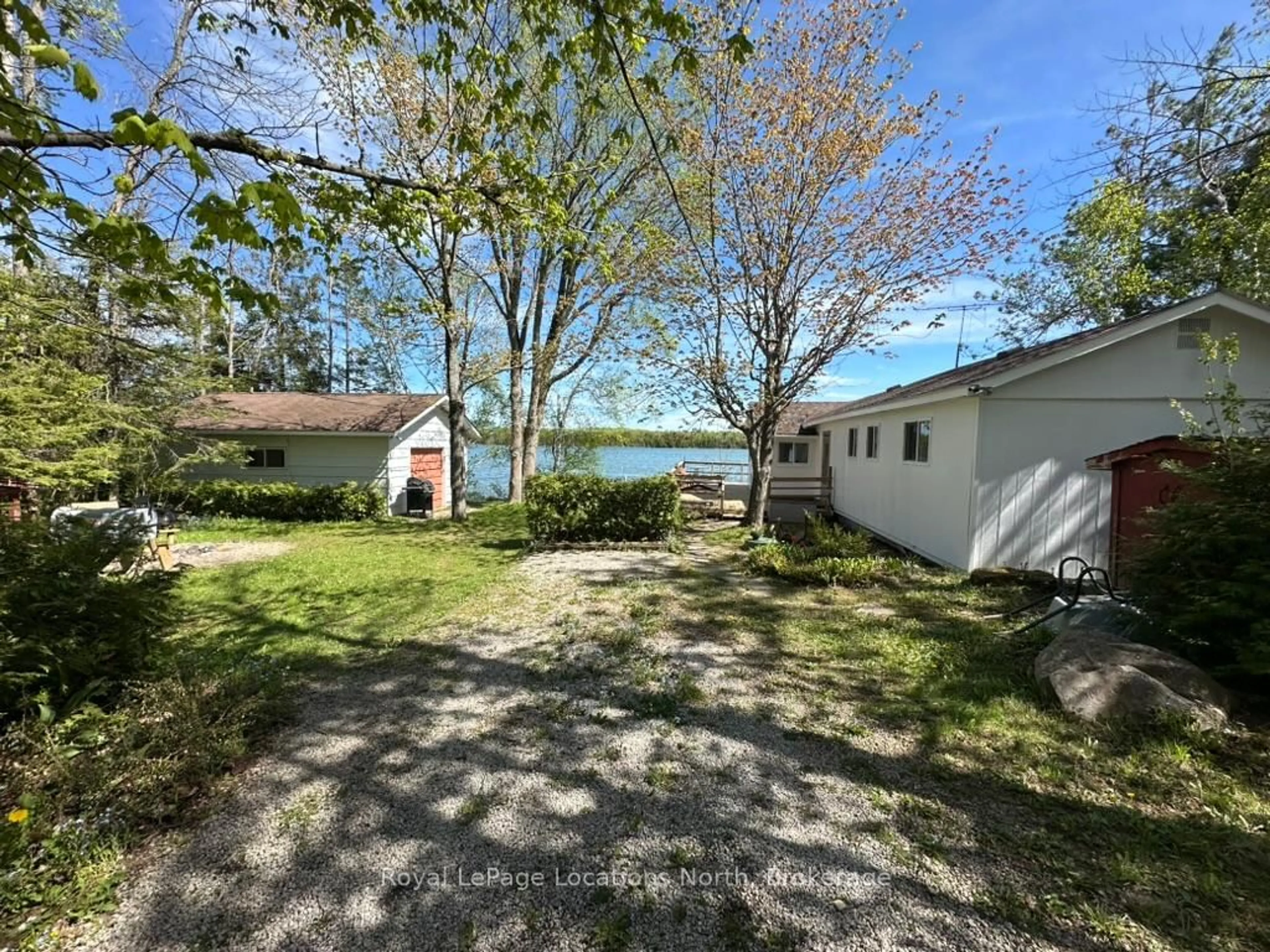 A pic from outside/outdoor area/front of a property/back of a property/a pic from drone, water/lake/river/ocean view for 62 Miller Lake Shore Rd, Northern Bruce Peninsula Ontario N0H 1Z0