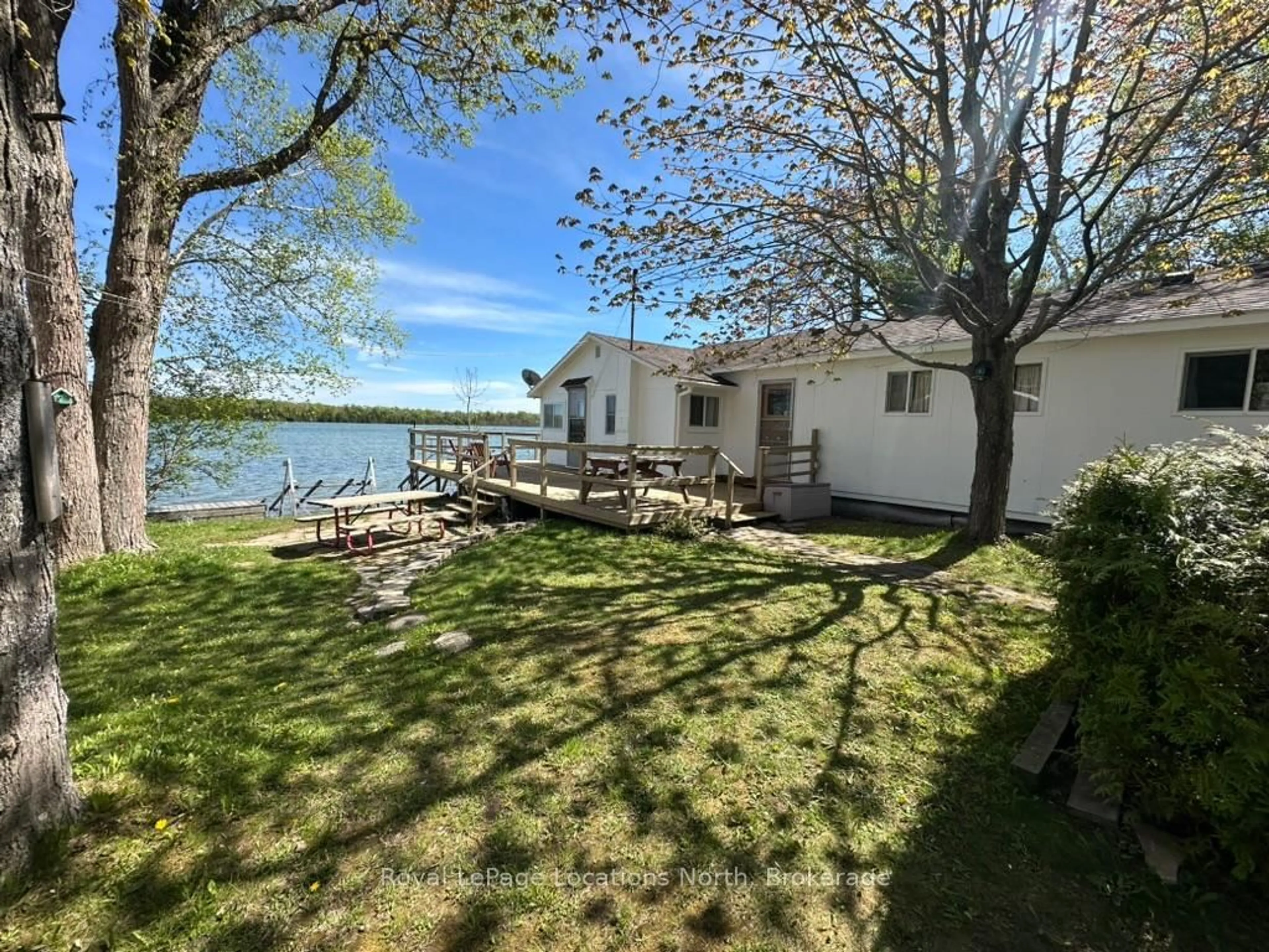 A pic from outside/outdoor area/front of a property/back of a property/a pic from drone, water/lake/river/ocean view for 62 Miller Lake Shore Rd, Northern Bruce Peninsula Ontario N0H 1Z0