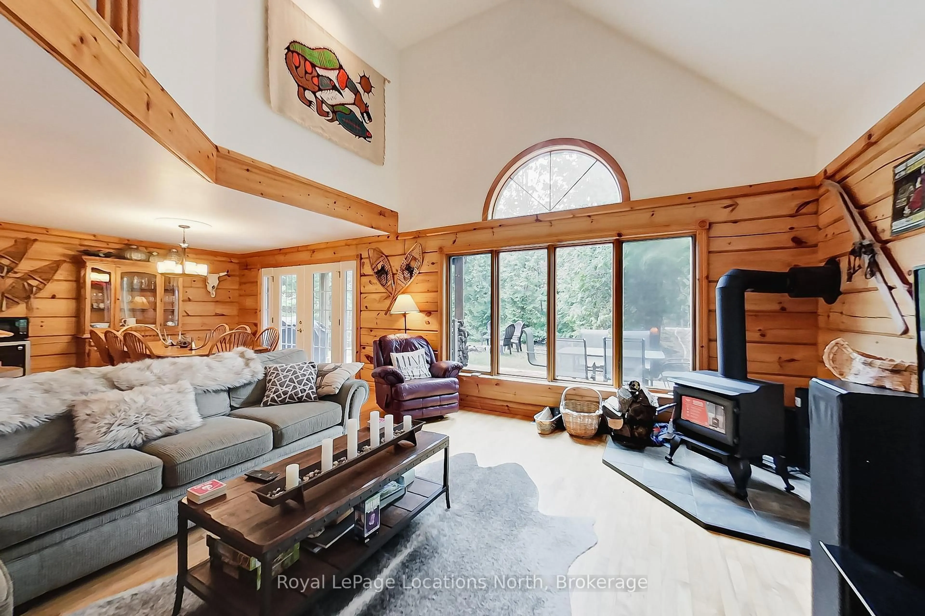 Living room with furniture, wood/laminate floor for 208554 26 Highway, Blue Mountains Ontario N0H 1J0