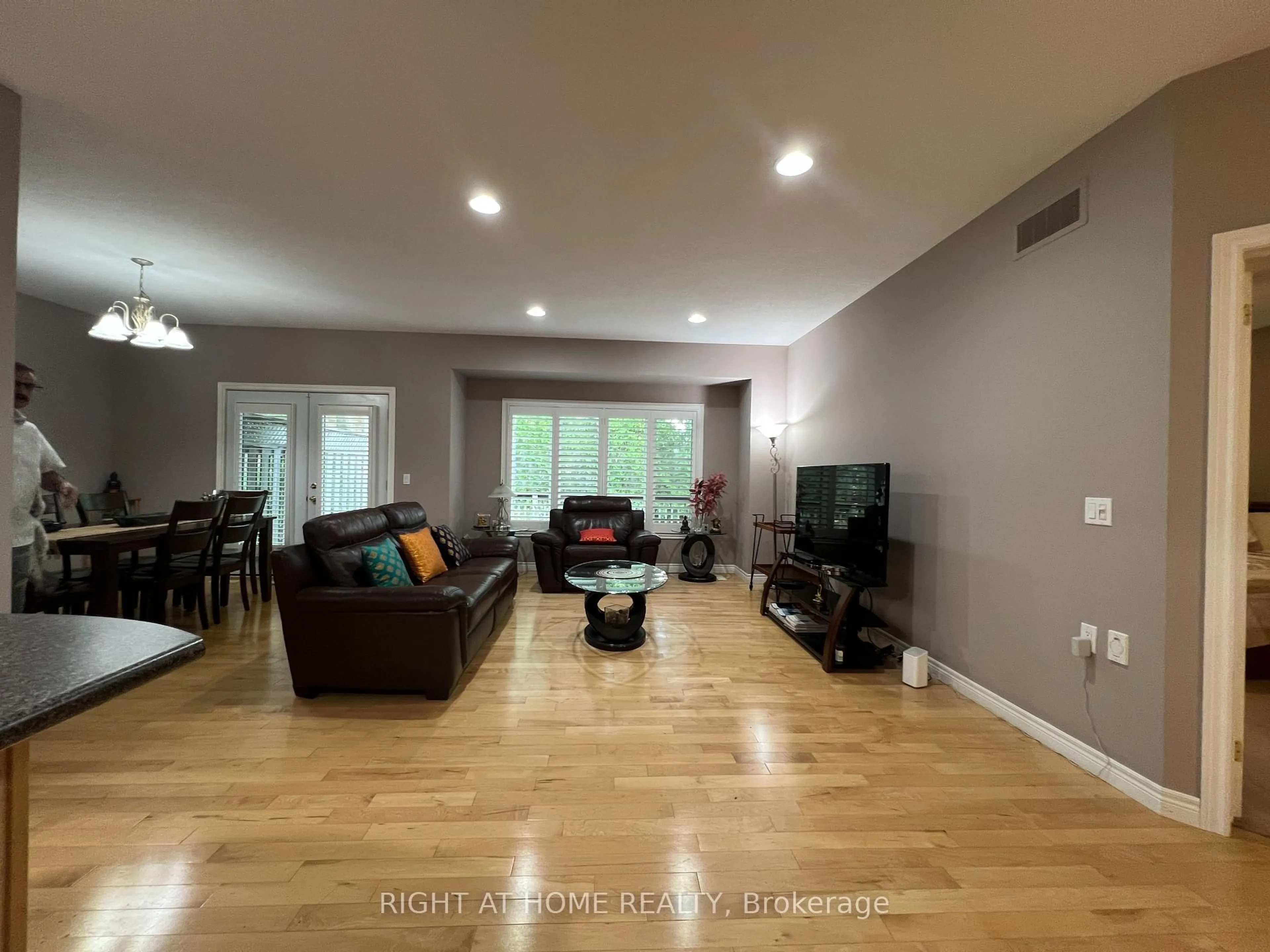 Living room with furniture, wood/laminate floor for 1574 Richmond St #7, London North Ontario N6G 5H7