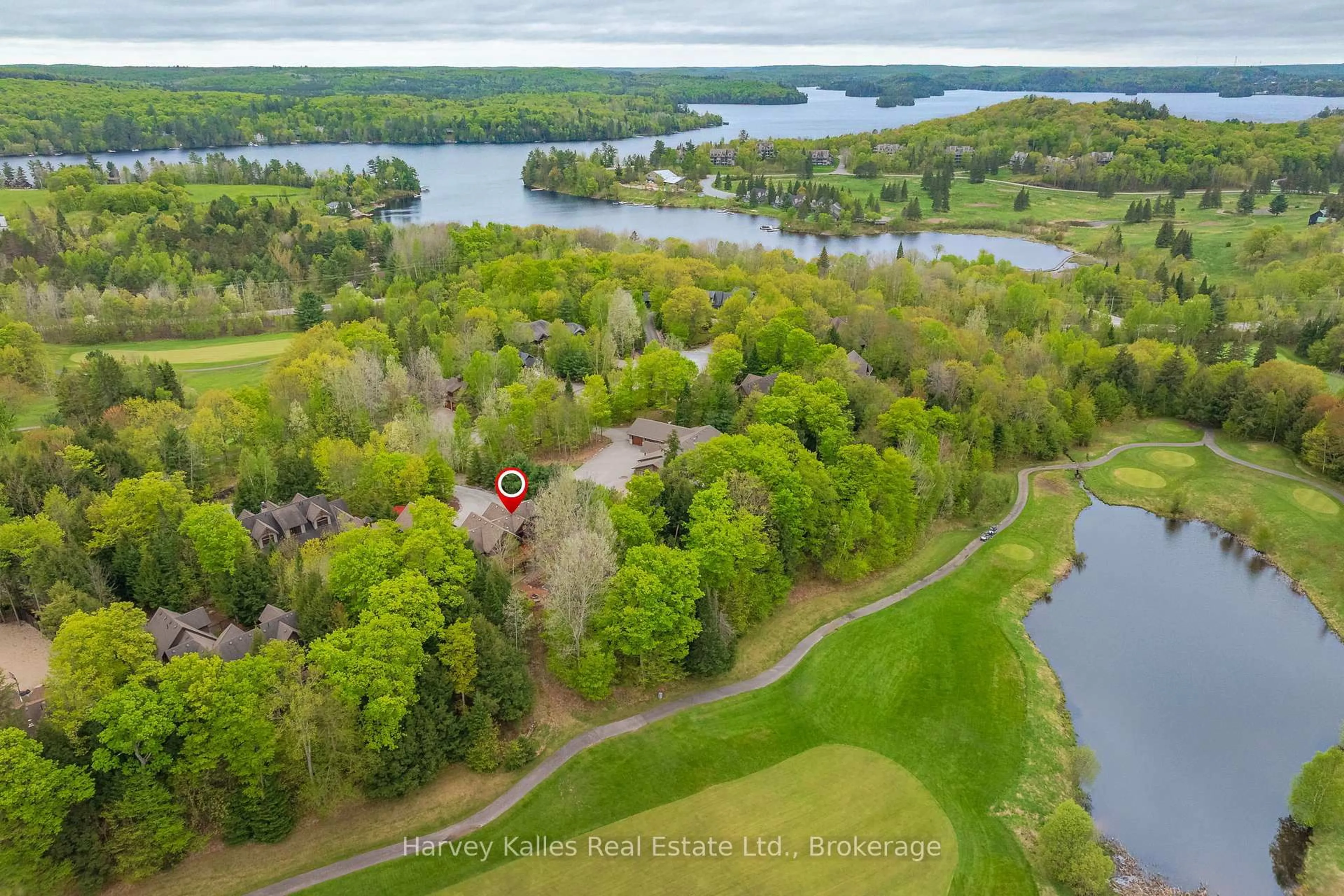 A pic from outside/outdoor area/front of a property/back of a property/a pic from drone, water/lake/river/ocean view for 63 Clubhouse Dr, Huntsville Ontario P1H 1B1
