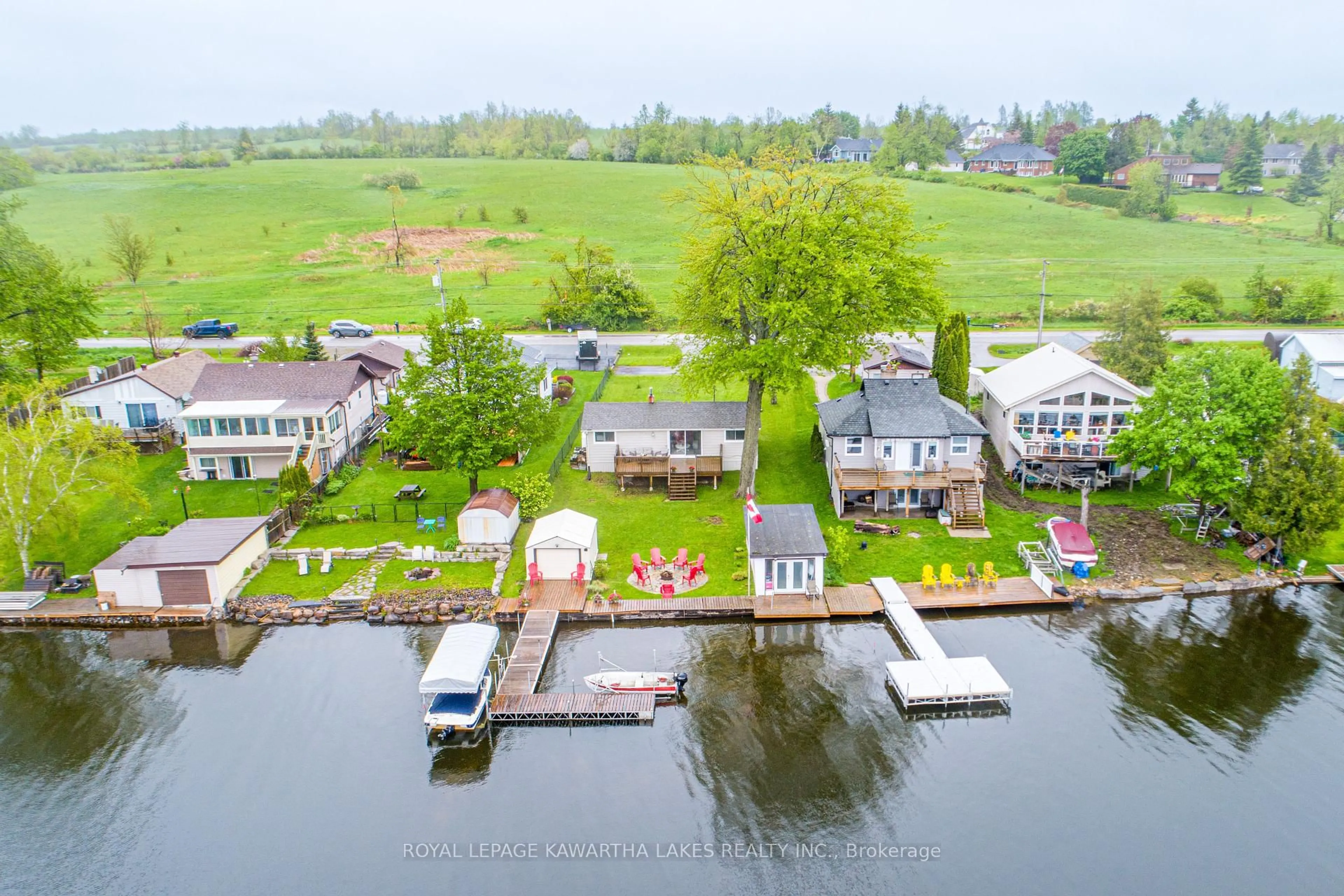 A pic from outside/outdoor area/front of a property/back of a property/a pic from drone, water/lake/river/ocean view for 215 Snug Harbour Rd, Kawartha Lakes Ontario K9V 4R6