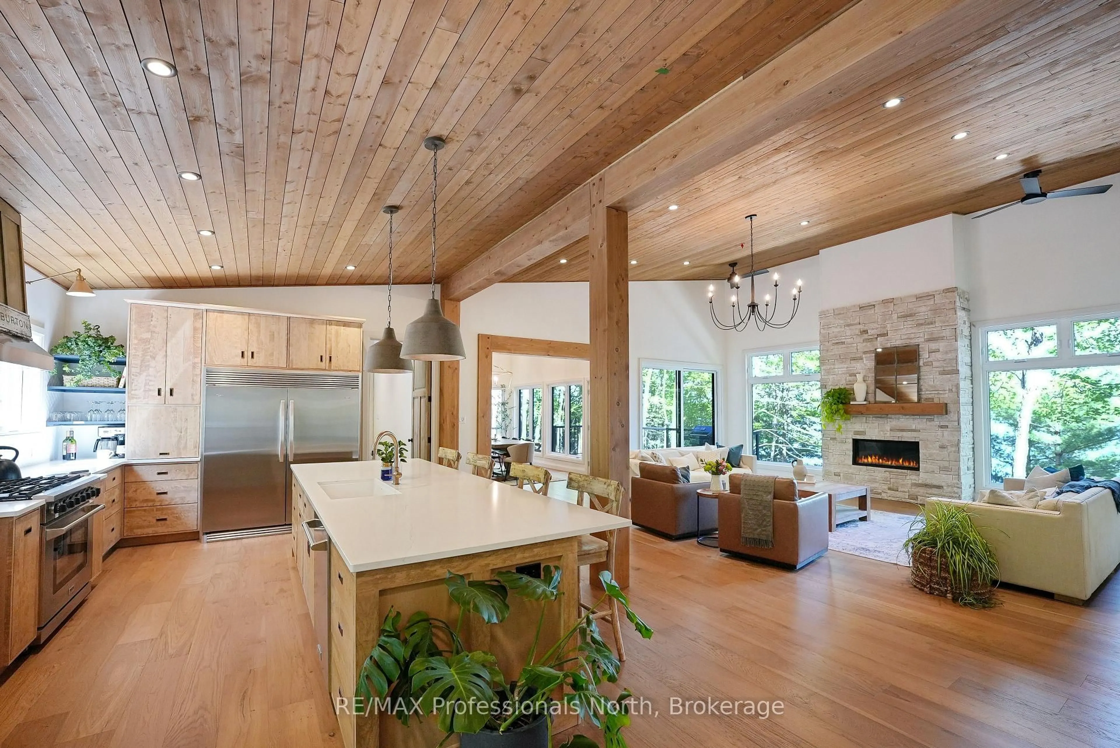 Open concept kitchen, wood/laminate floor for 1041 Minaki Lane, Minden Hills Ontario K0M 2K0