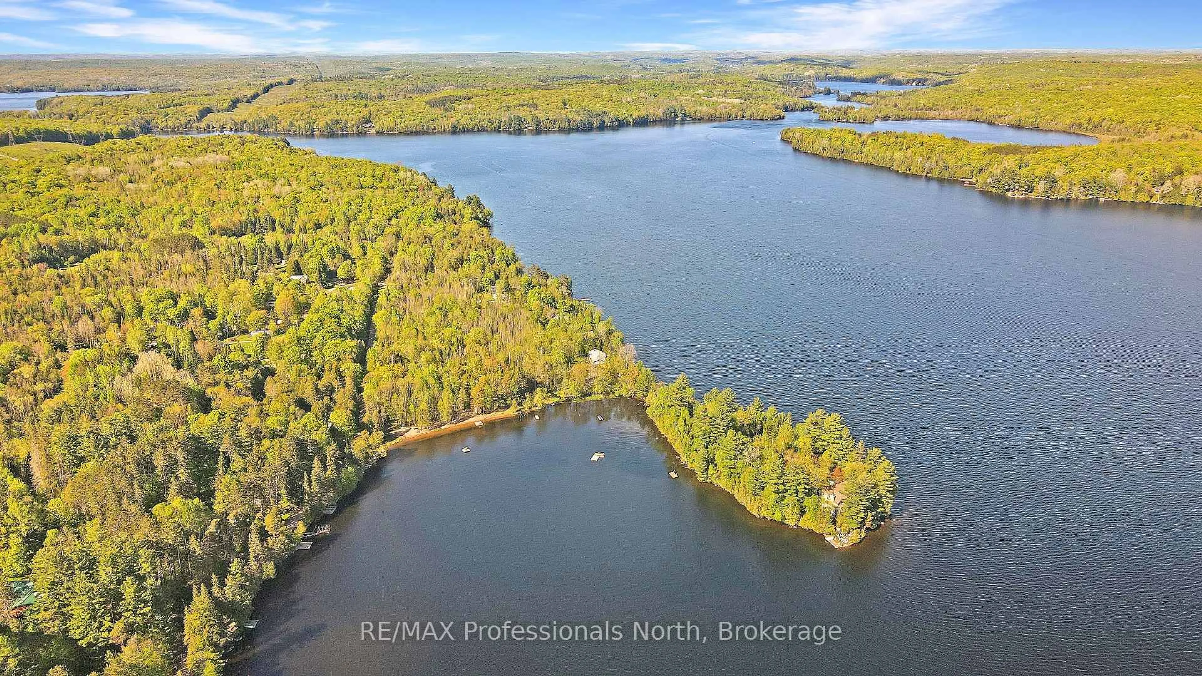 A pic from outside/outdoor area/front of a property/back of a property/a pic from drone, water/lake/river/ocean view for 1041 Minaki Lane, Minden Hills Ontario K0M 2K0
