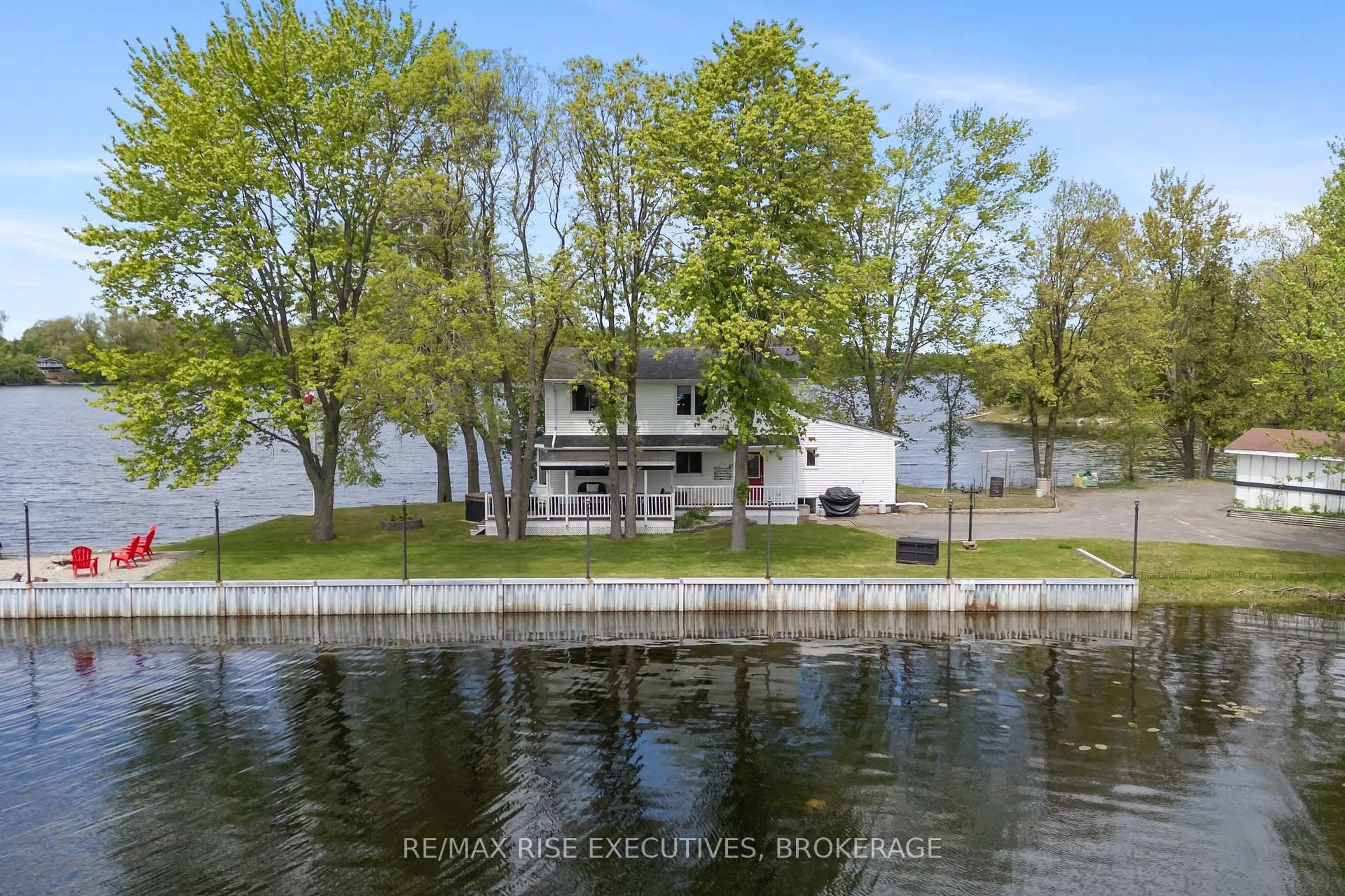 A pic from outside/outdoor area/front of a property/back of a property/a pic from drone, water/lake/river/ocean view for 1043 Morning Glory Lane, Verona Ontario K0H 2W0