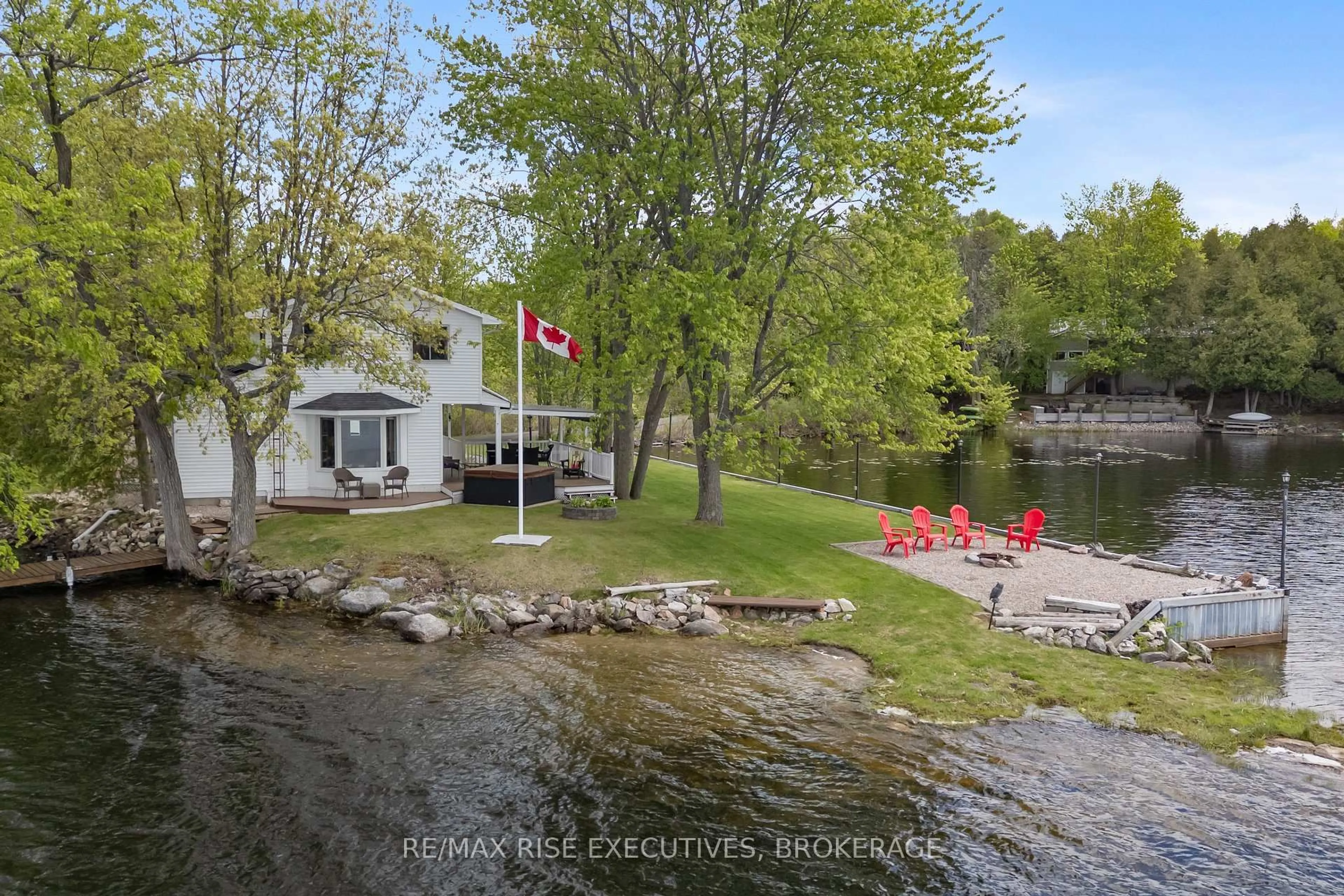 A pic from outside/outdoor area/front of a property/back of a property/a pic from drone, water/lake/river/ocean view for 1043 Morning Glory Lane, Verona Ontario K0H 2W0