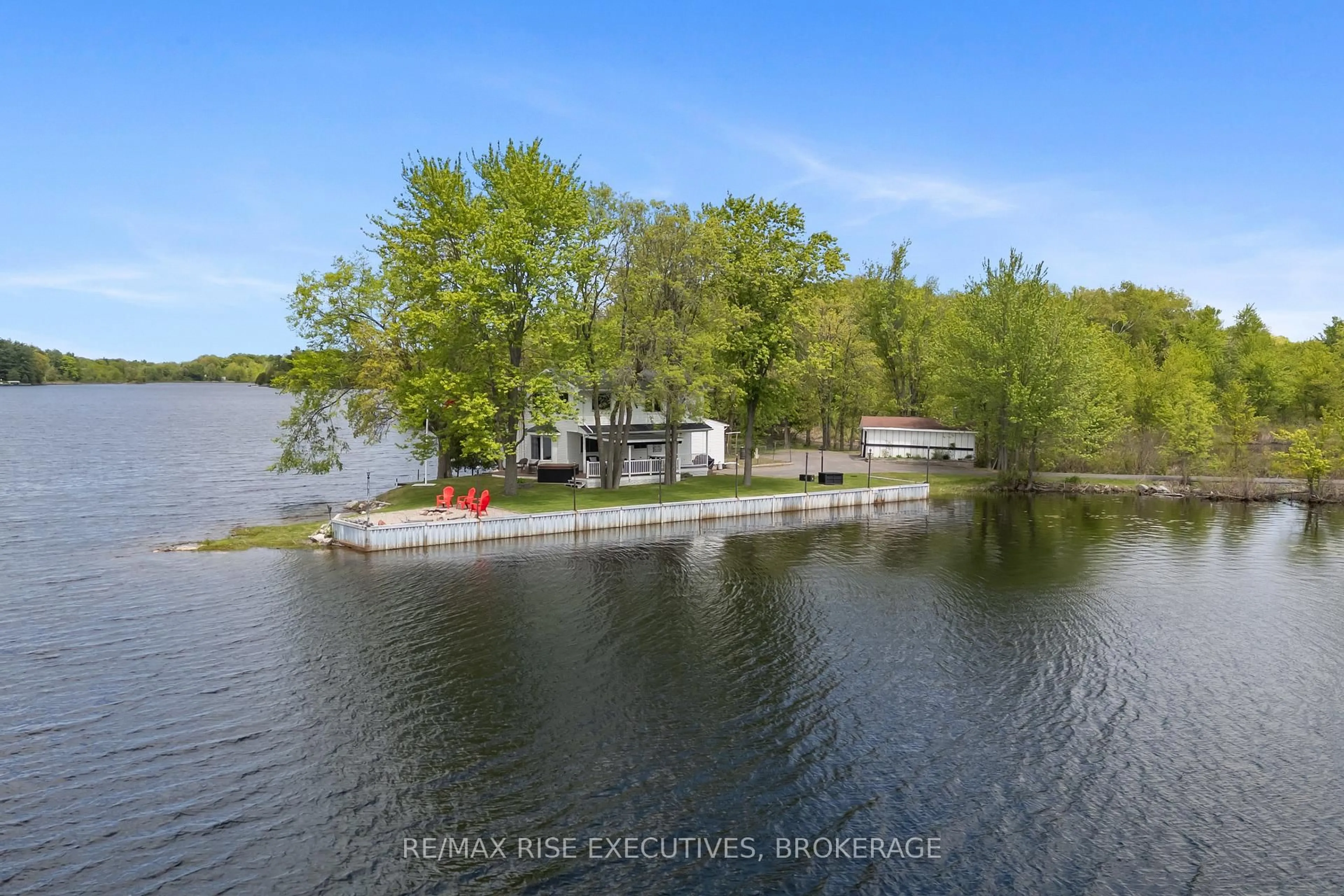 A pic from outside/outdoor area/front of a property/back of a property/a pic from drone, water/lake/river/ocean view for 1043 Morning Glory Lane, Verona Ontario K0H 2W0