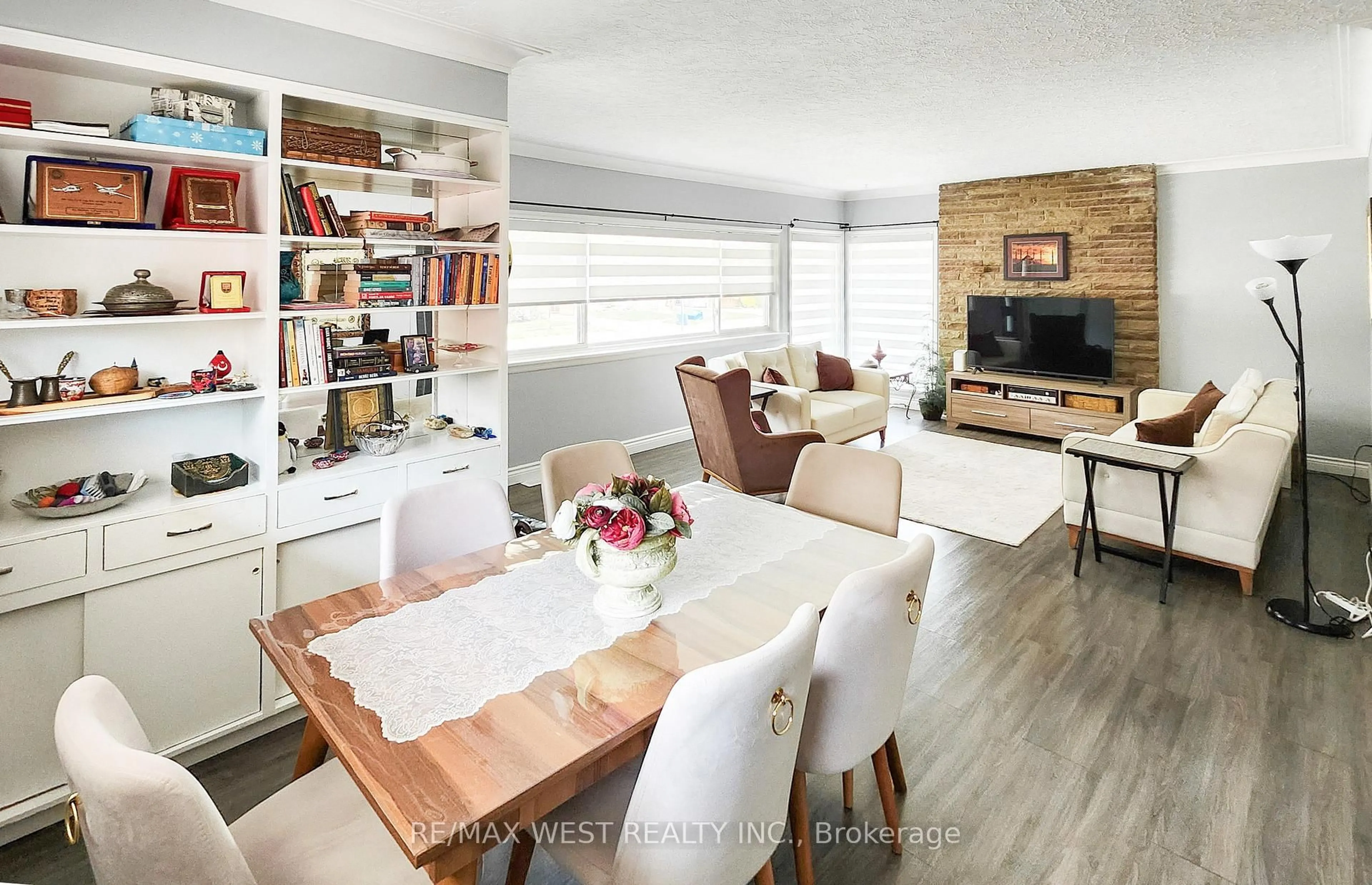 Living room with furniture, wood/laminate floor for 90 Strathcona Ave, Brantford Ontario N3S 1T9