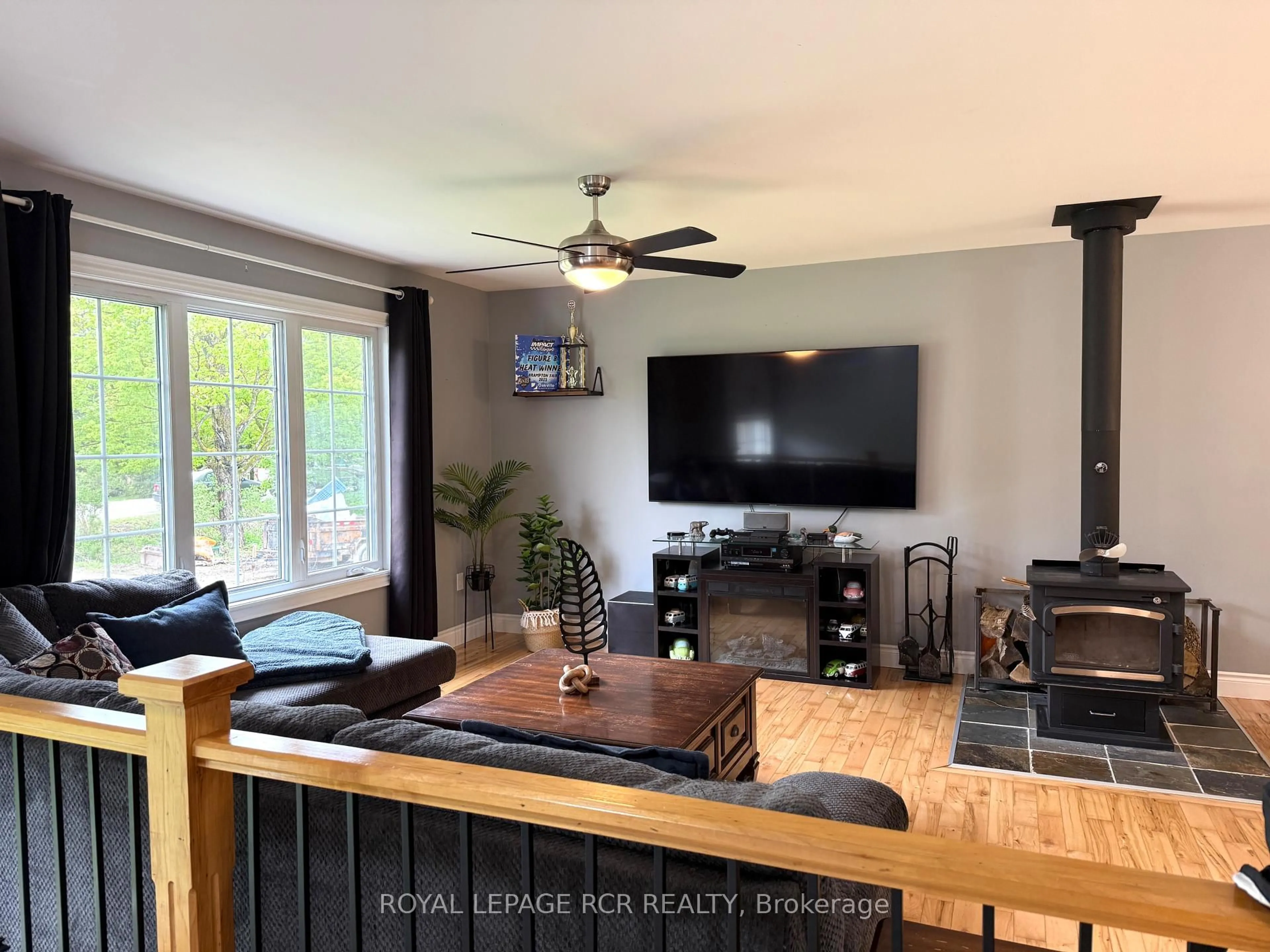 Living room with furniture, wood/laminate floor for 402187 County Road 15 N/A, East Luther Grand Valley Ontario L9W 3B5