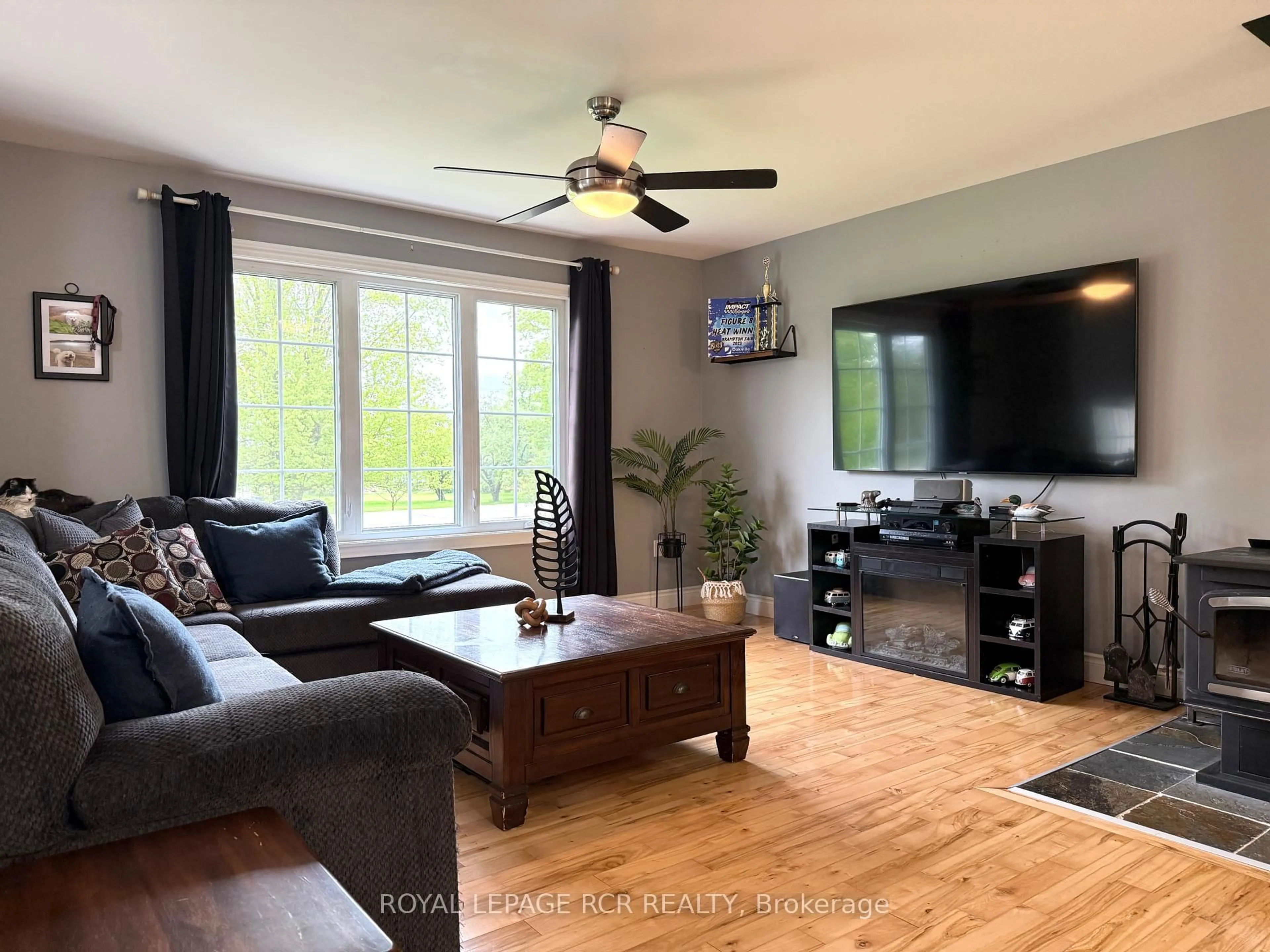 Living room with furniture, wood/laminate floor for 402187 County Road 15 N/A, East Luther Grand Valley Ontario L9W 3B5