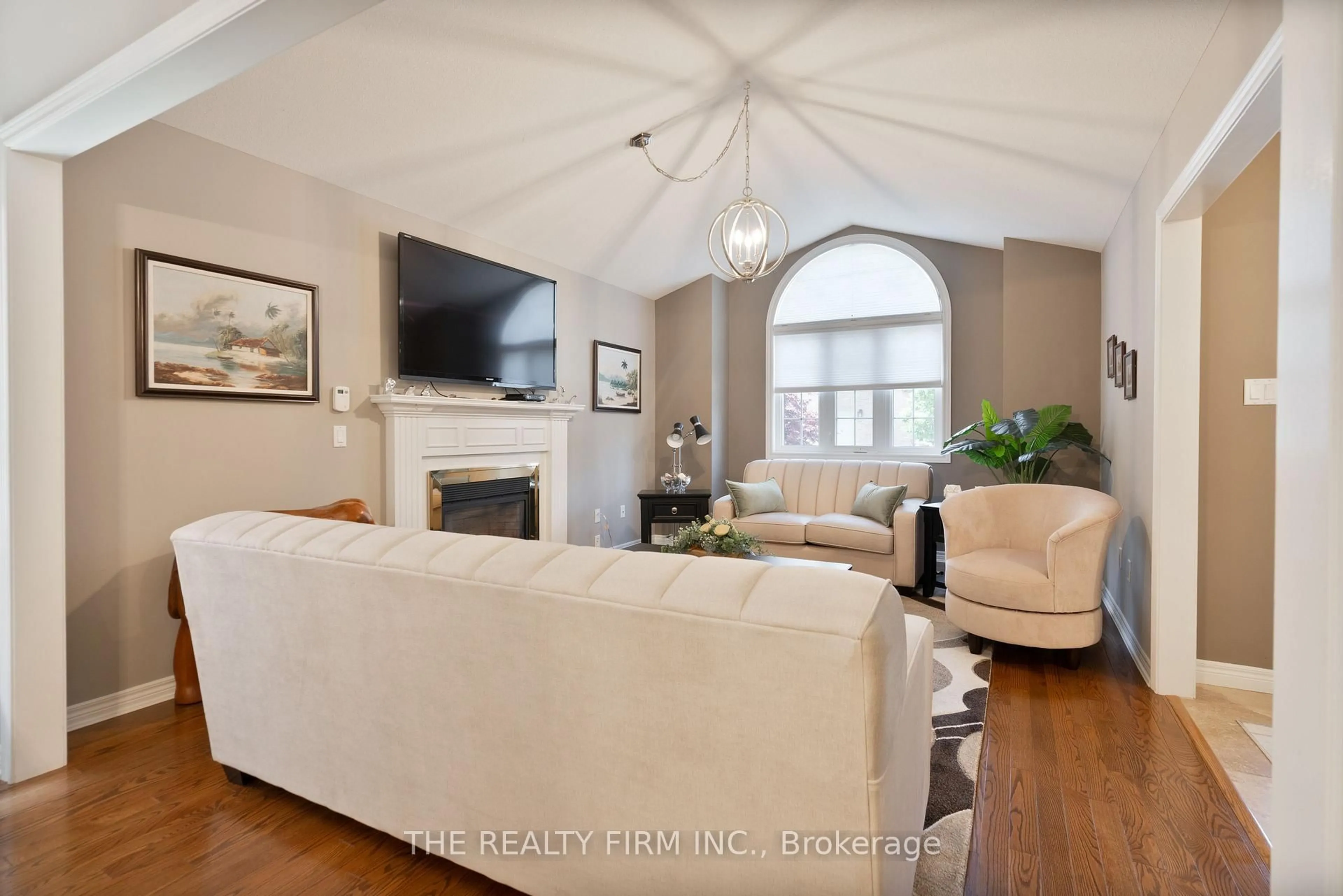 Living room with furniture, wood/laminate floor for 448 Commissioners Rd #11, London South Ontario N6C 2T7