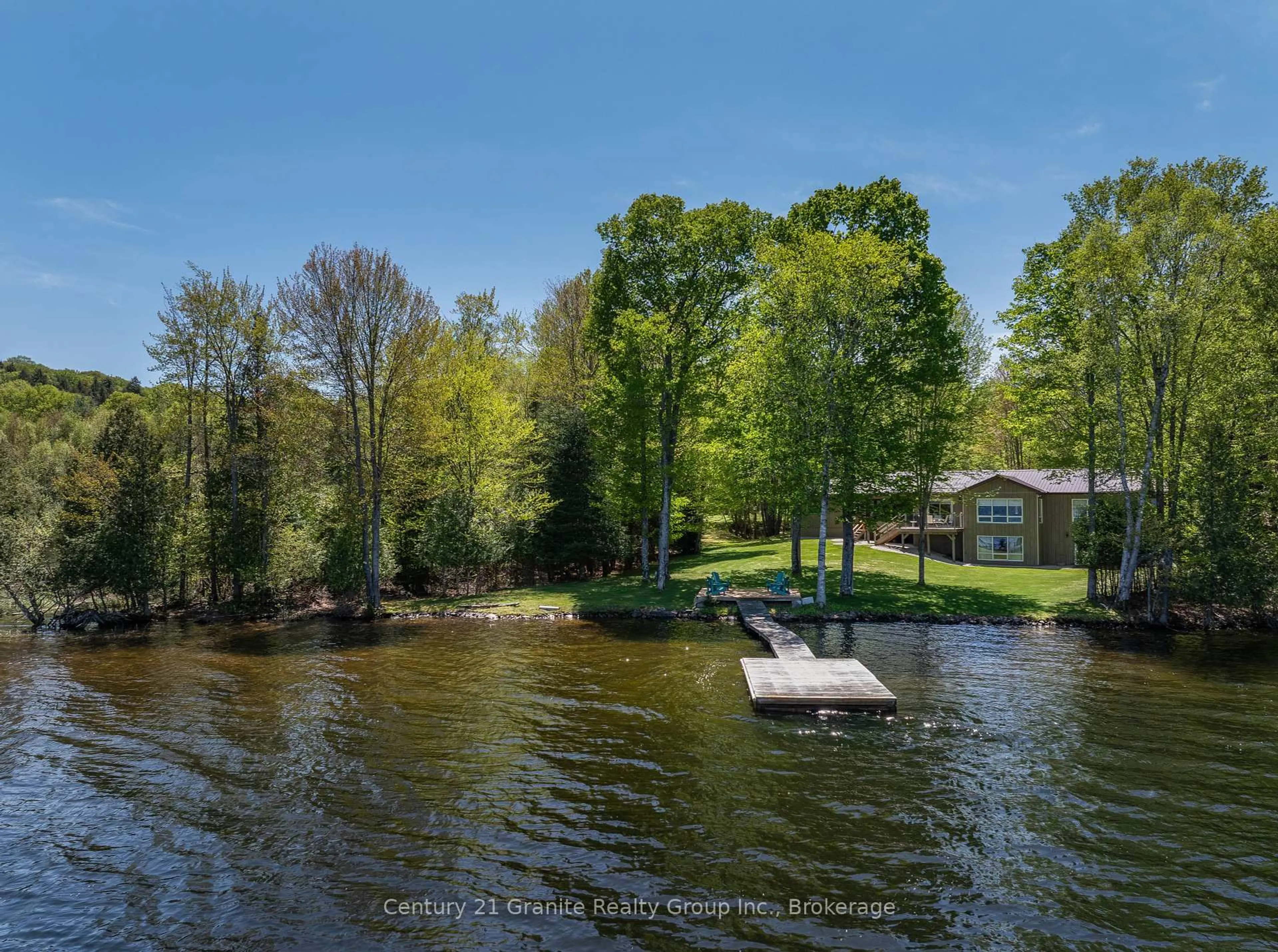 A pic from outside/outdoor area/front of a property/back of a property/a pic from drone, water/lake/river/ocean view for 1192 Elk Dr, Dysart et al Ontario K0M 1S0