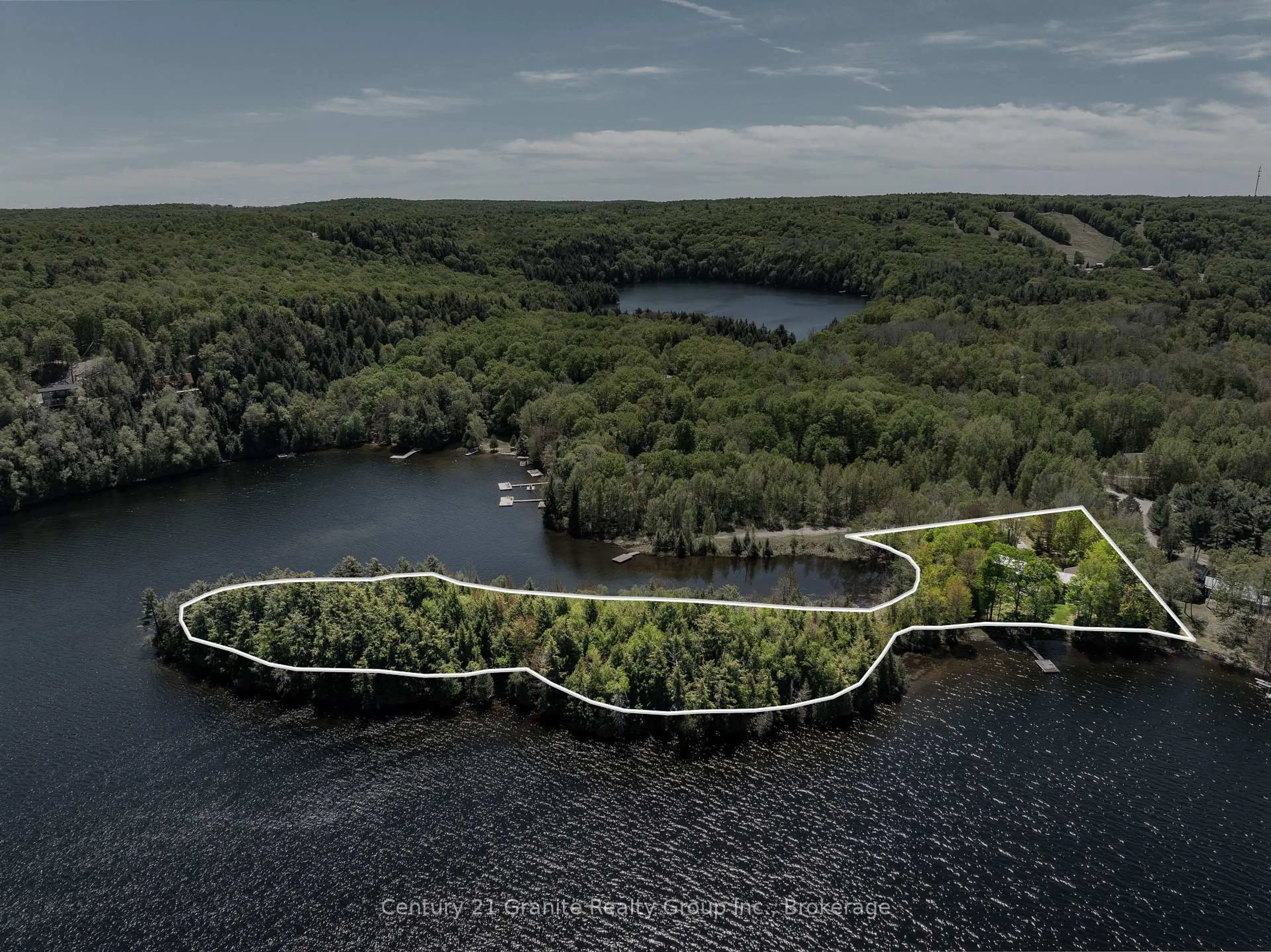 A pic from outside/outdoor area/front of a property/back of a property/a pic from drone, water/lake/river/ocean view for 1192 Elk Dr, Dysart et al Ontario K0M 1S0