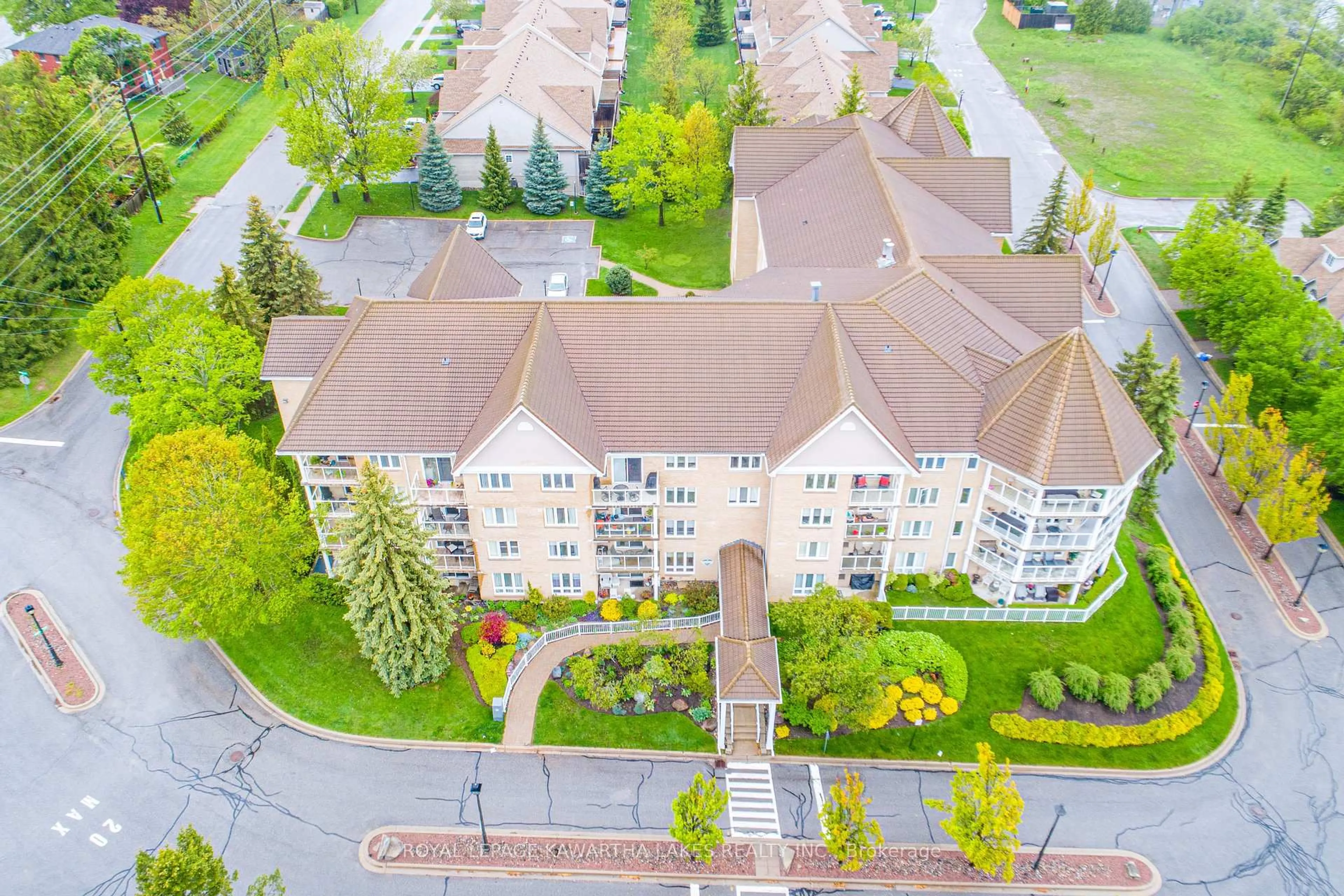 A pic from outside/outdoor area/front of a property/back of a property/a pic from drone, city buildings view from balcony for 51 Rivermill Blvd #203, Kawartha Lakes Ontario K9V 6E8