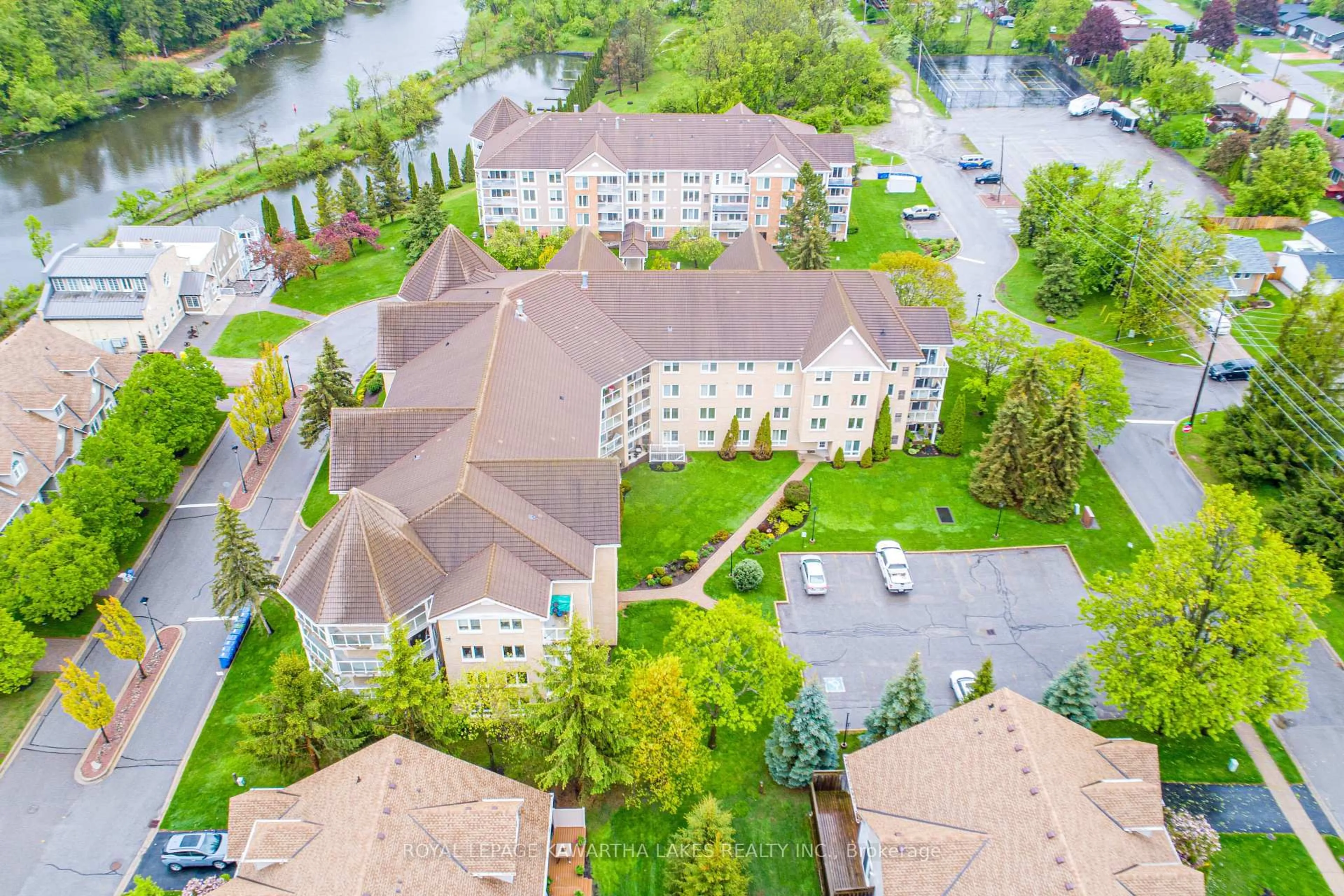 A pic from outside/outdoor area/front of a property/back of a property/a pic from drone, water/lake/river/ocean view for 51 Rivermill Blvd #203, Kawartha Lakes Ontario K9V 6E8