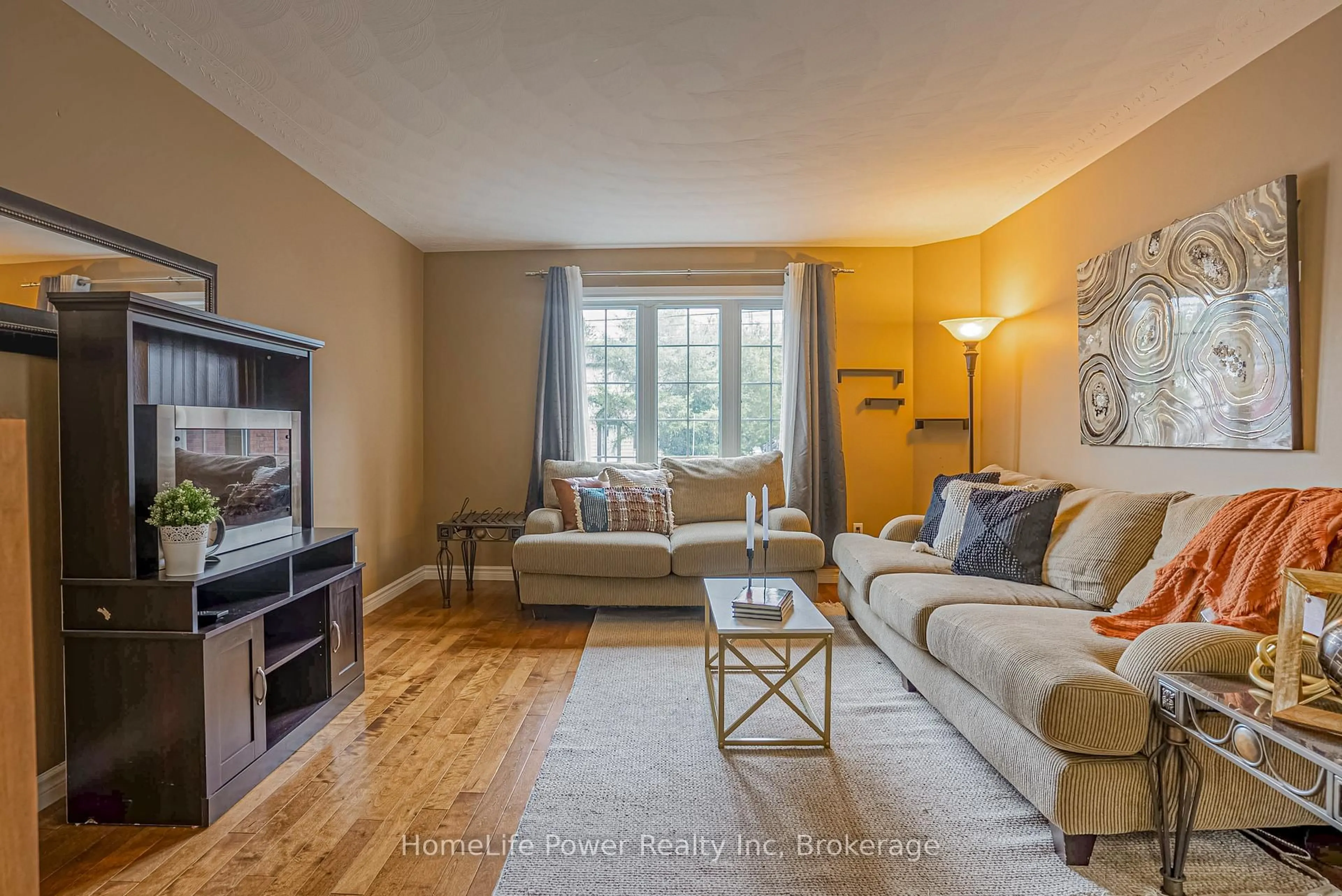 Living room with furniture, wood/laminate floor for 8 Copper St #B, Greater Sudbury Ontario P3E 2C2